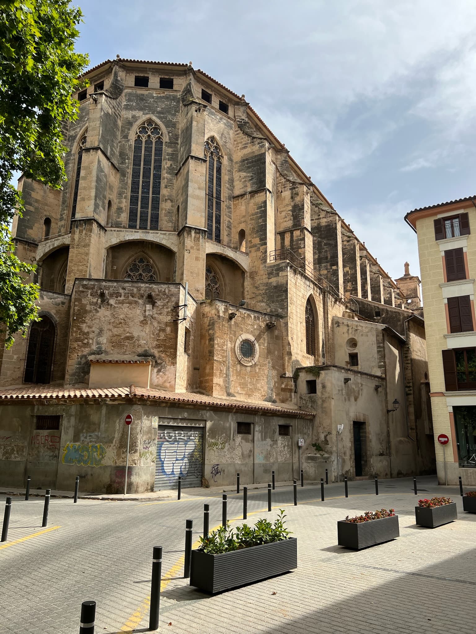 A tall brick building in a street