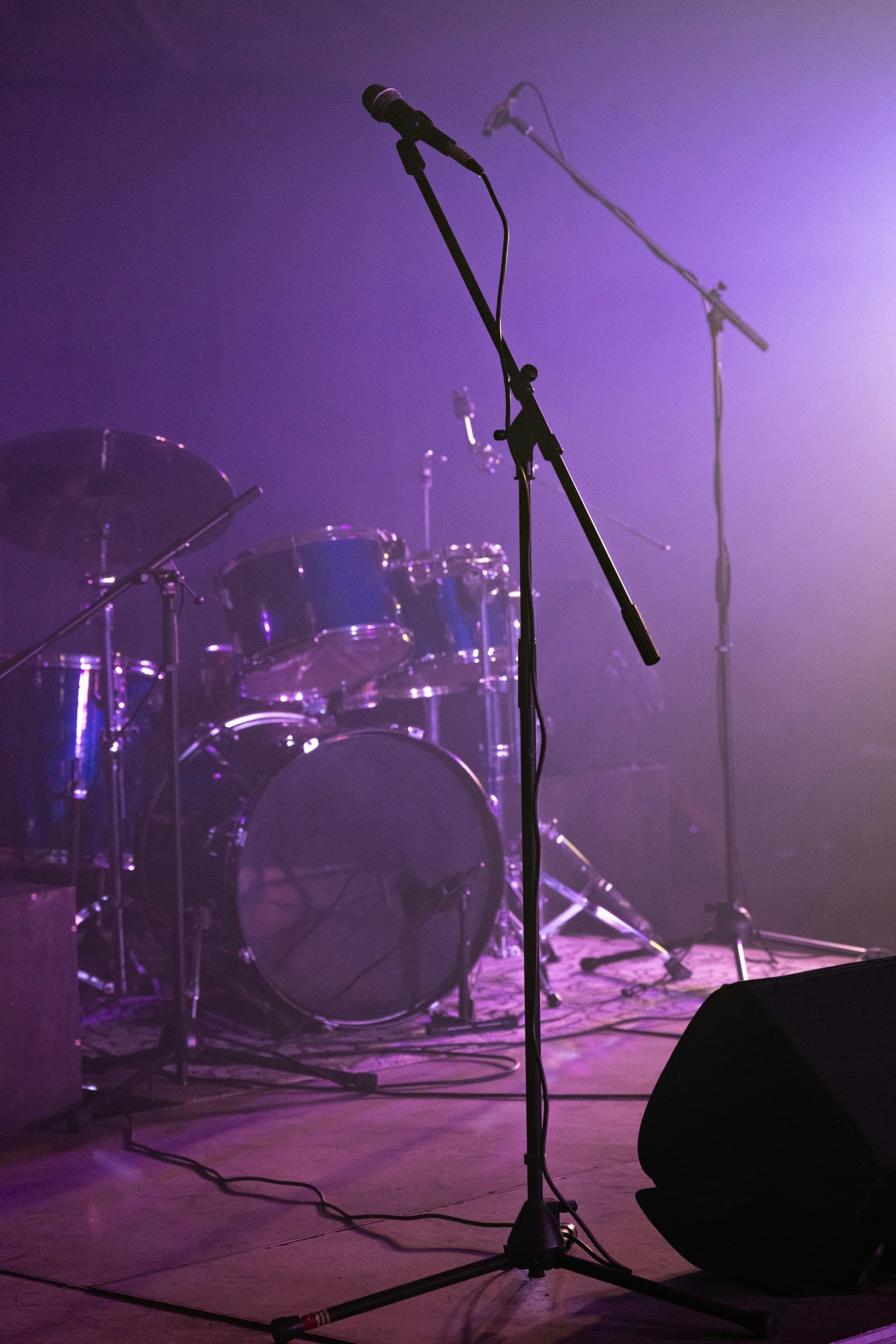A band set up on a purple-hued stage