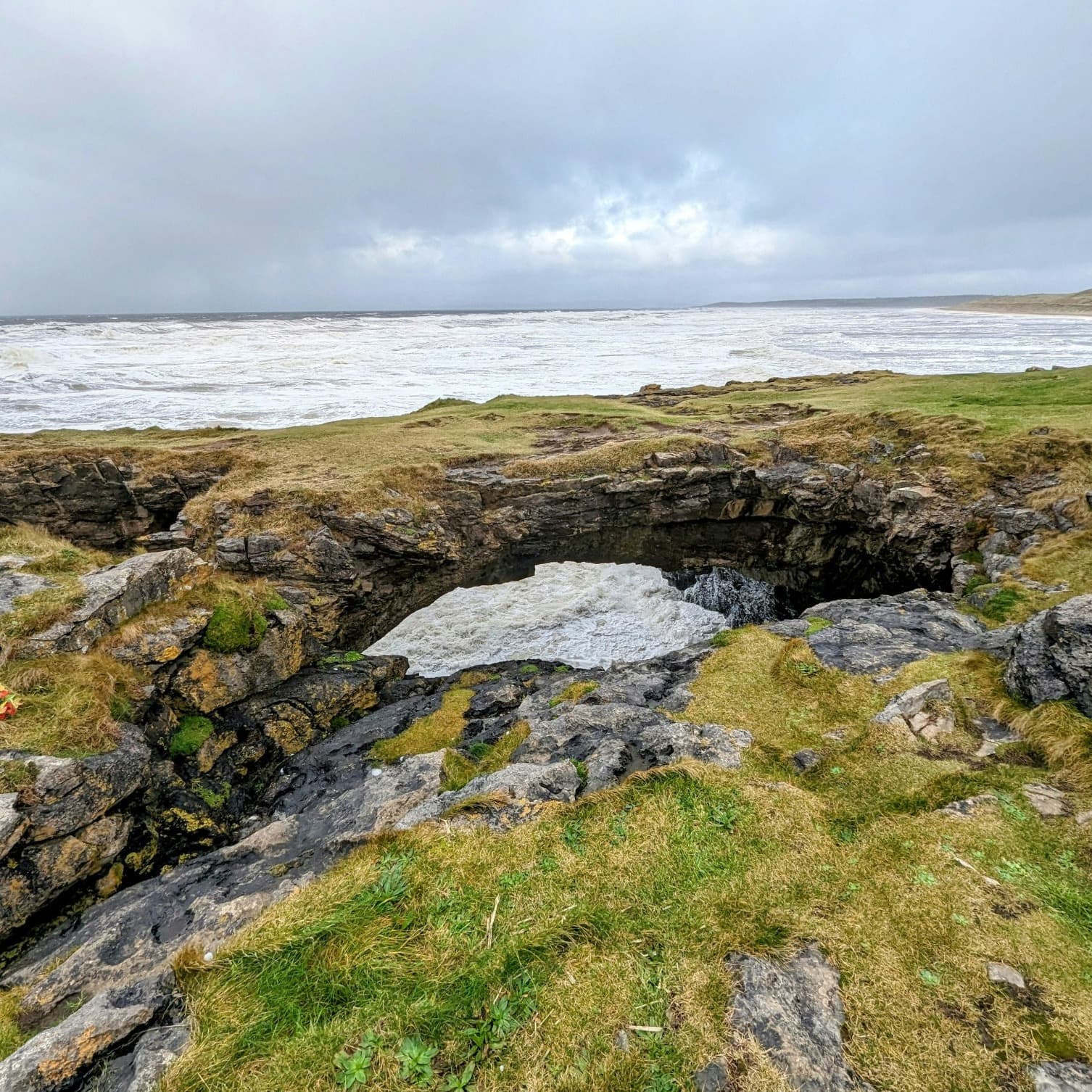 Rocky area with hole near the ocean on an Ireland 10 day itinerary.