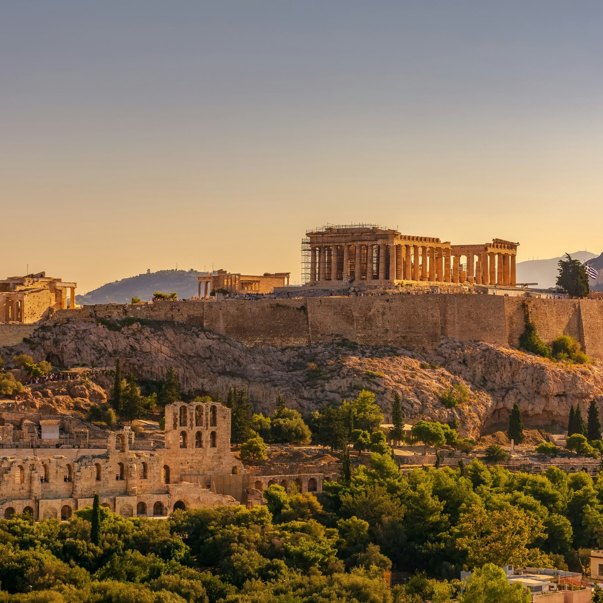 Ancient Greek ruins in Athens set atop a hill taken during the day