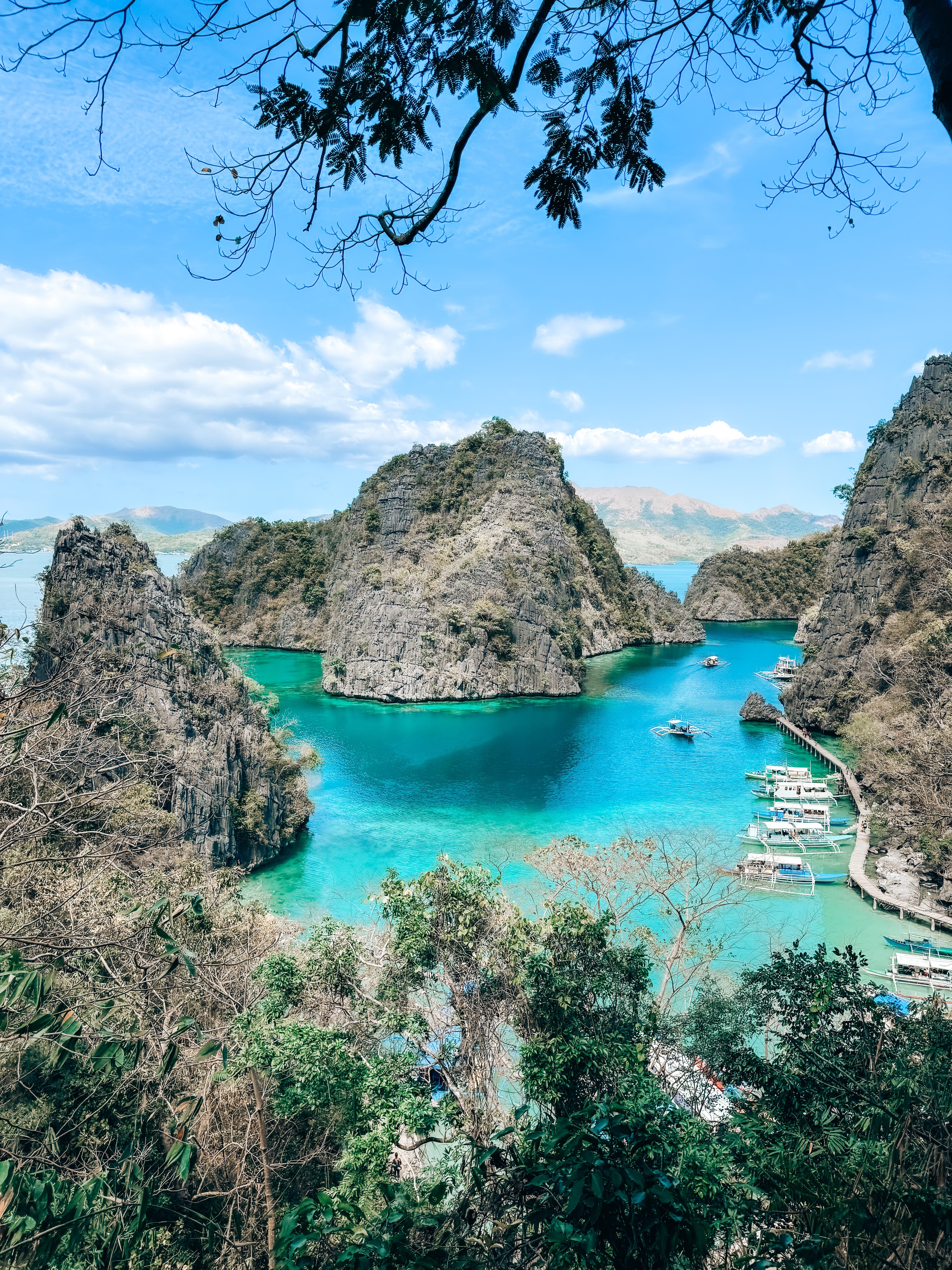 Aerial view of the ocean with rocky mountains.