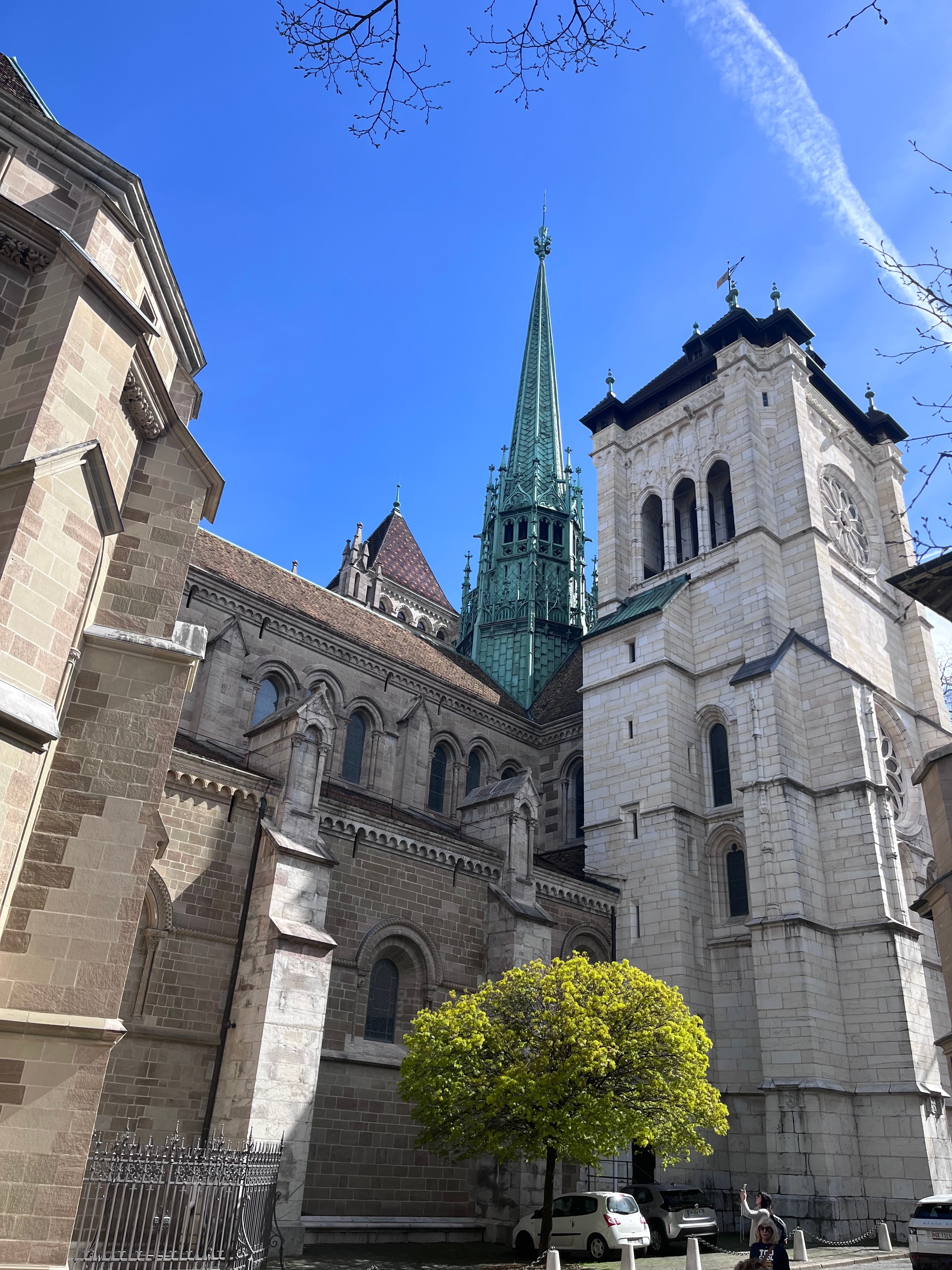 A tall chapel and other buildings during the daytime