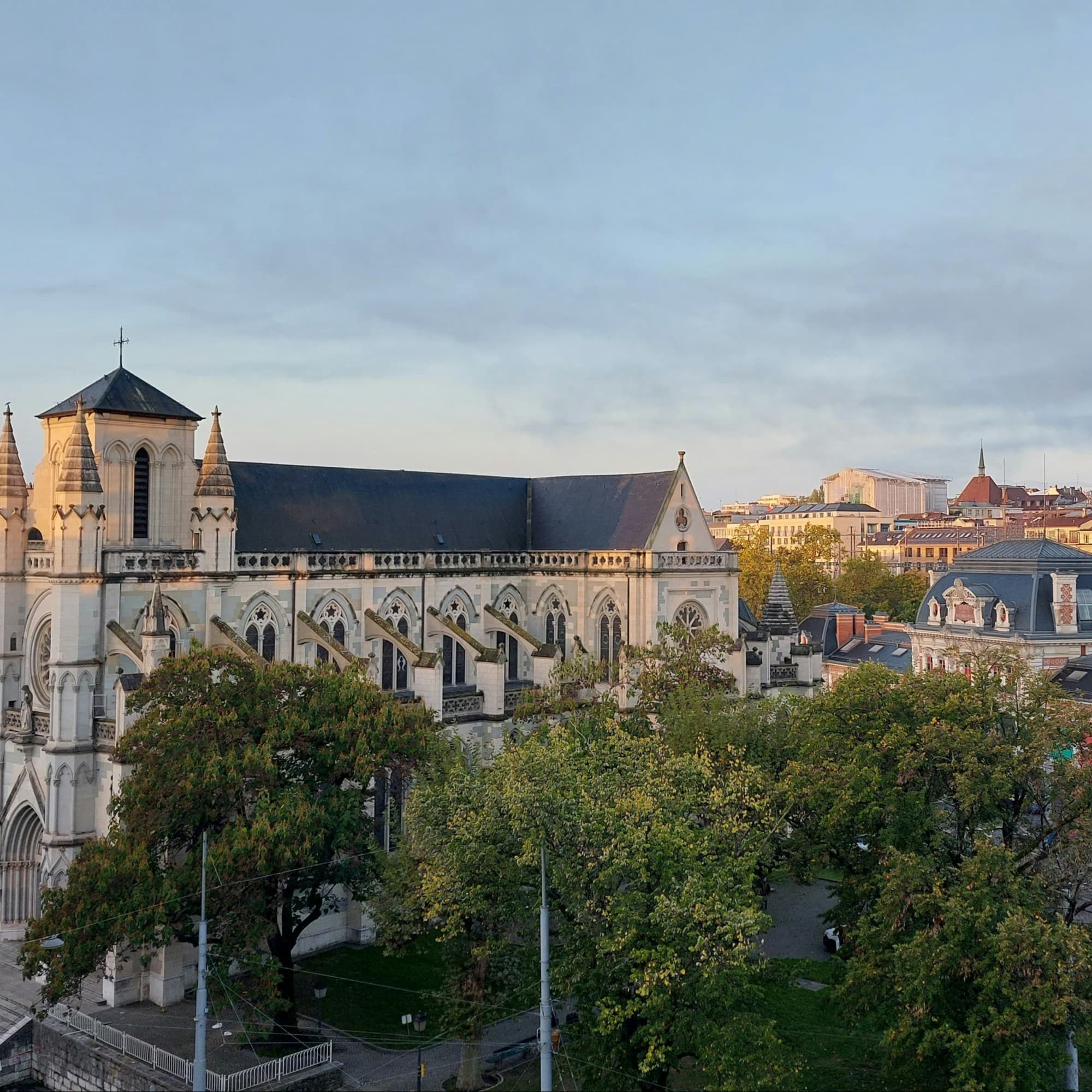 A big church with trees at front.
