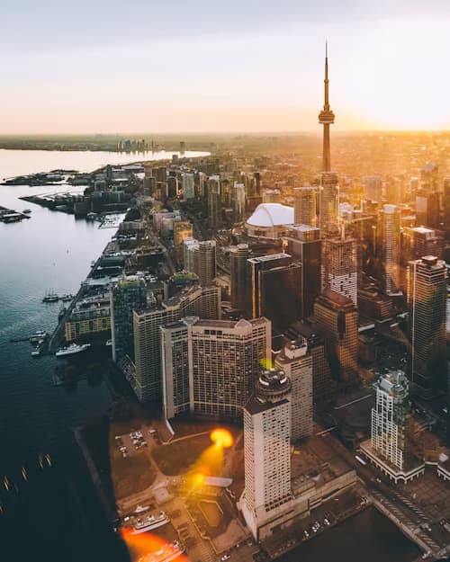 Aerial view of Toronto city skyline during orange hour.