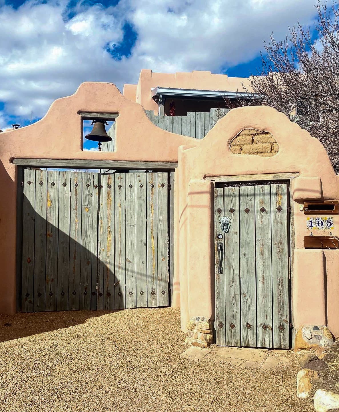 Two wooden doors with an orange cement outline