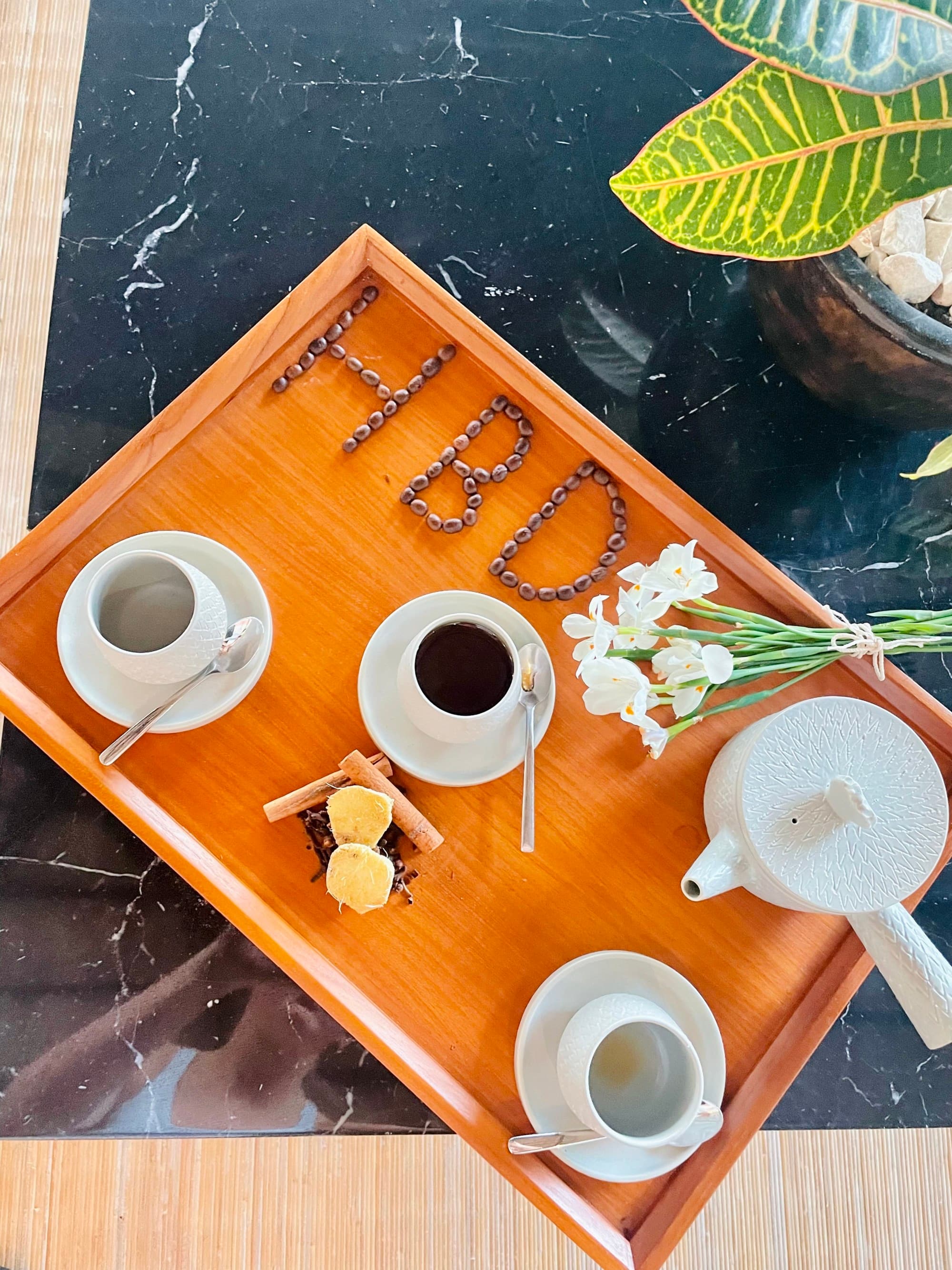 Herbal tea and raw local honey on a tray.