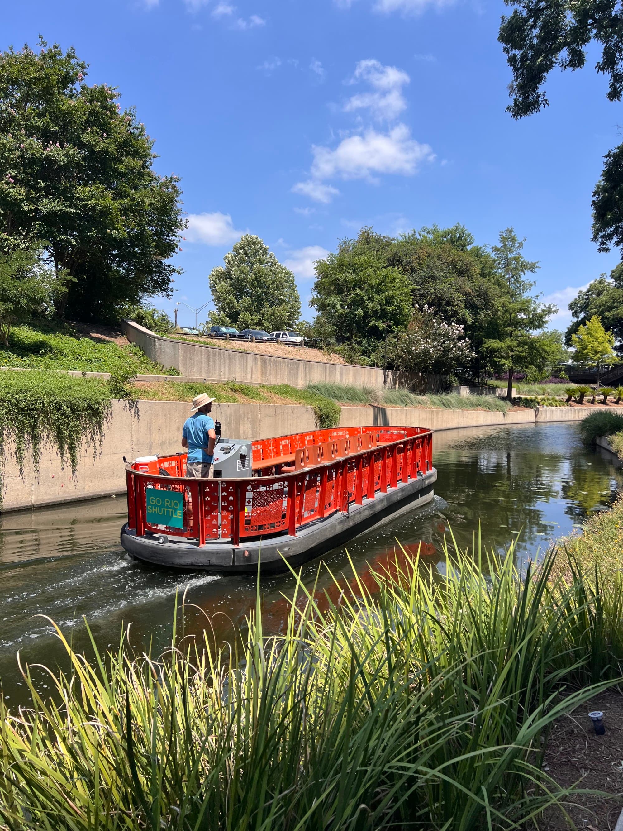 A longboat on a river during the daytime