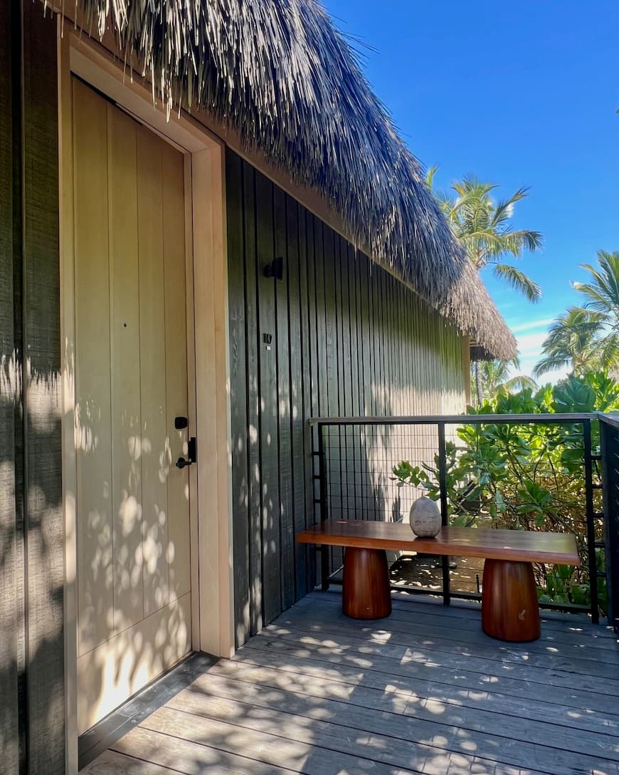 The outside of a straw-roofed building
