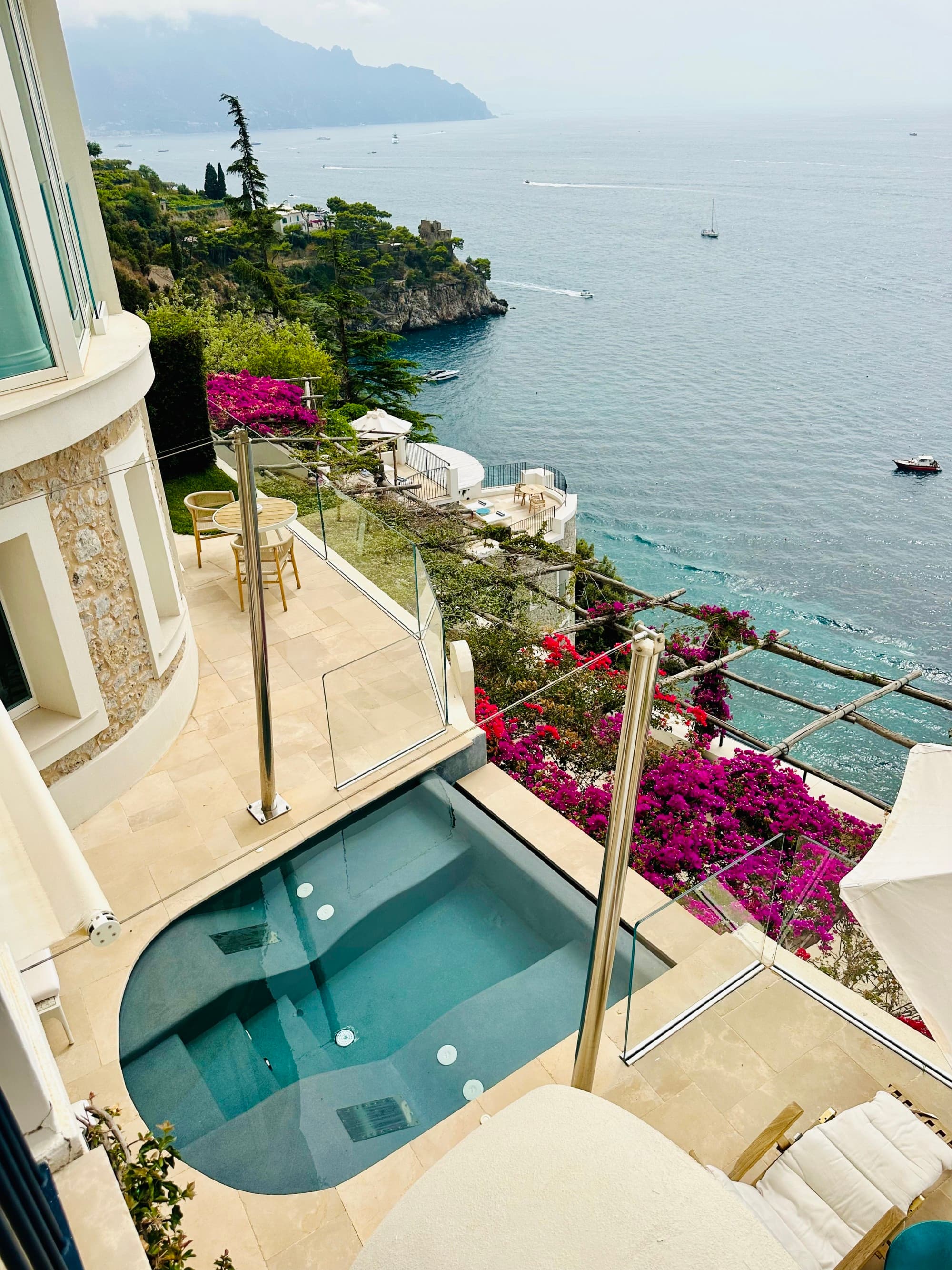 Borgo Sant'Andrea view from a premium plus suite looks down to the clear waters below as local flora climb the terrace.