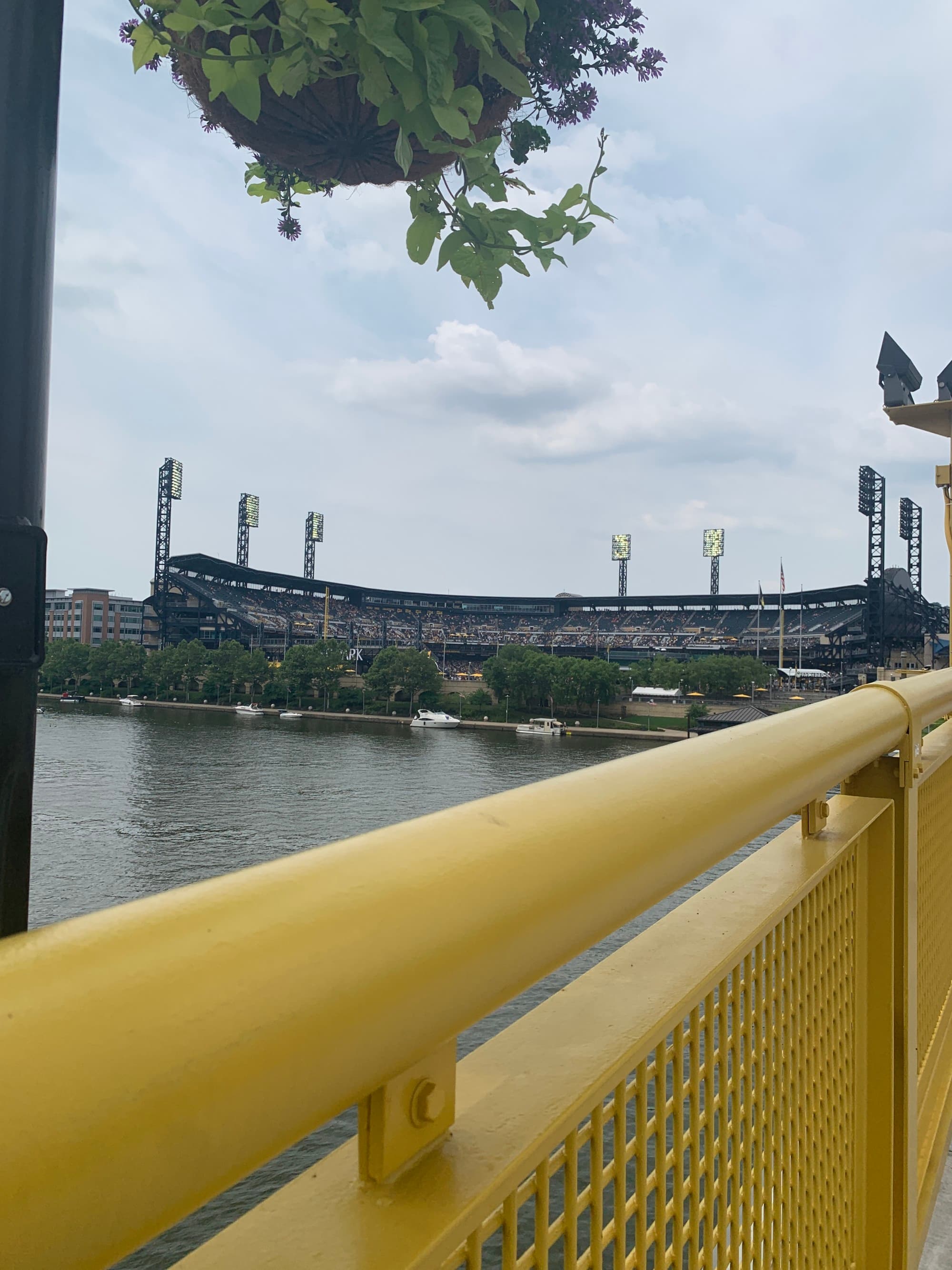 Bridge with a view of the ballpark across the water.