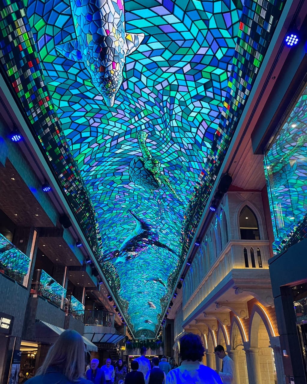 A mosaic dome over a hallway with shopping stalls at the Euribia LED Dome at Sea at the Galleria - Leah Chen