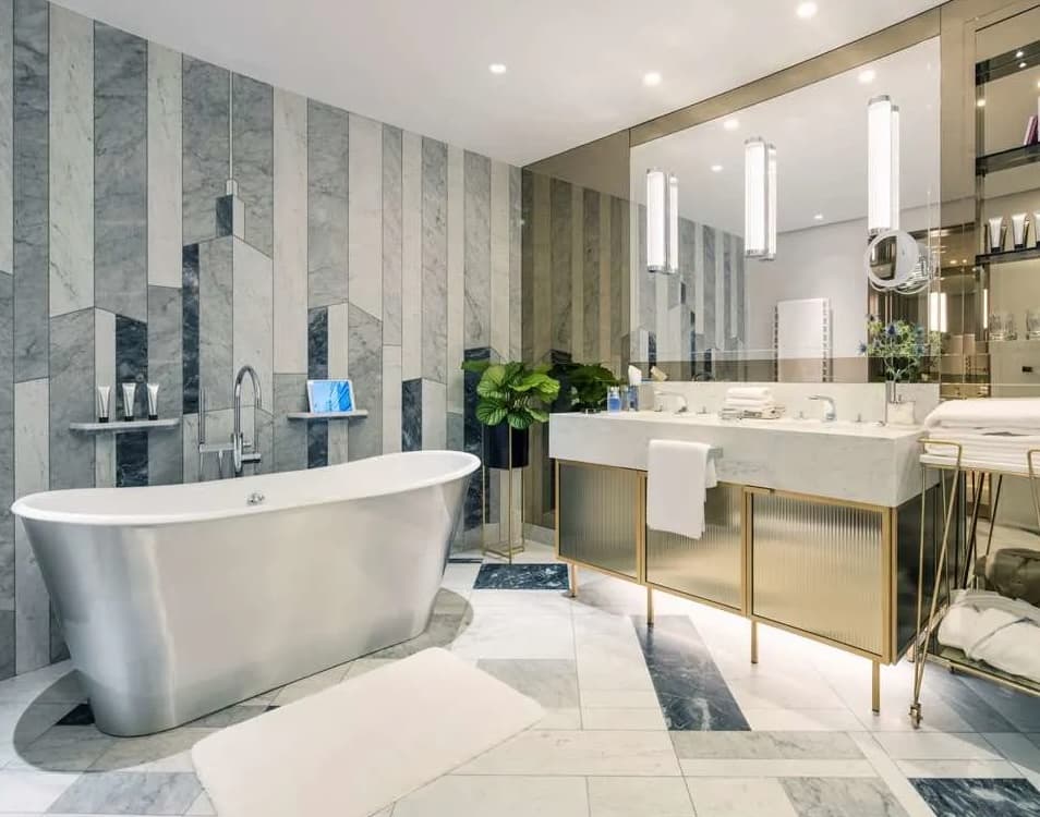 marble bathroom with a soaking tube and double vanity