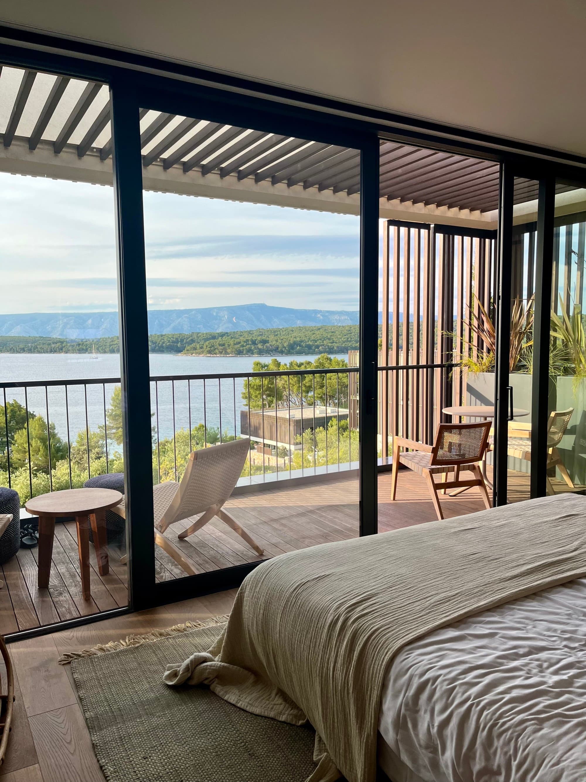 Hotel room with sliding-glass doors and a patio.
