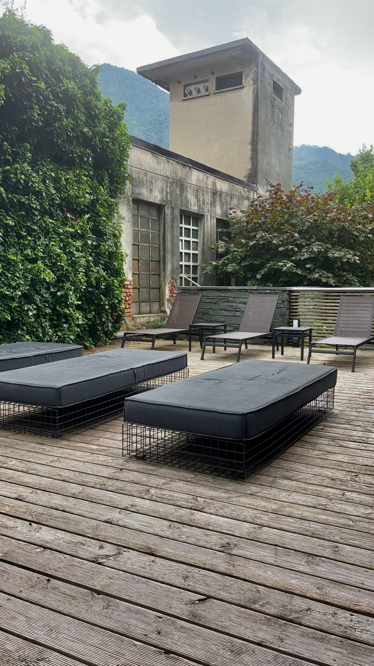 Outside view of the villa with lounge chairs.