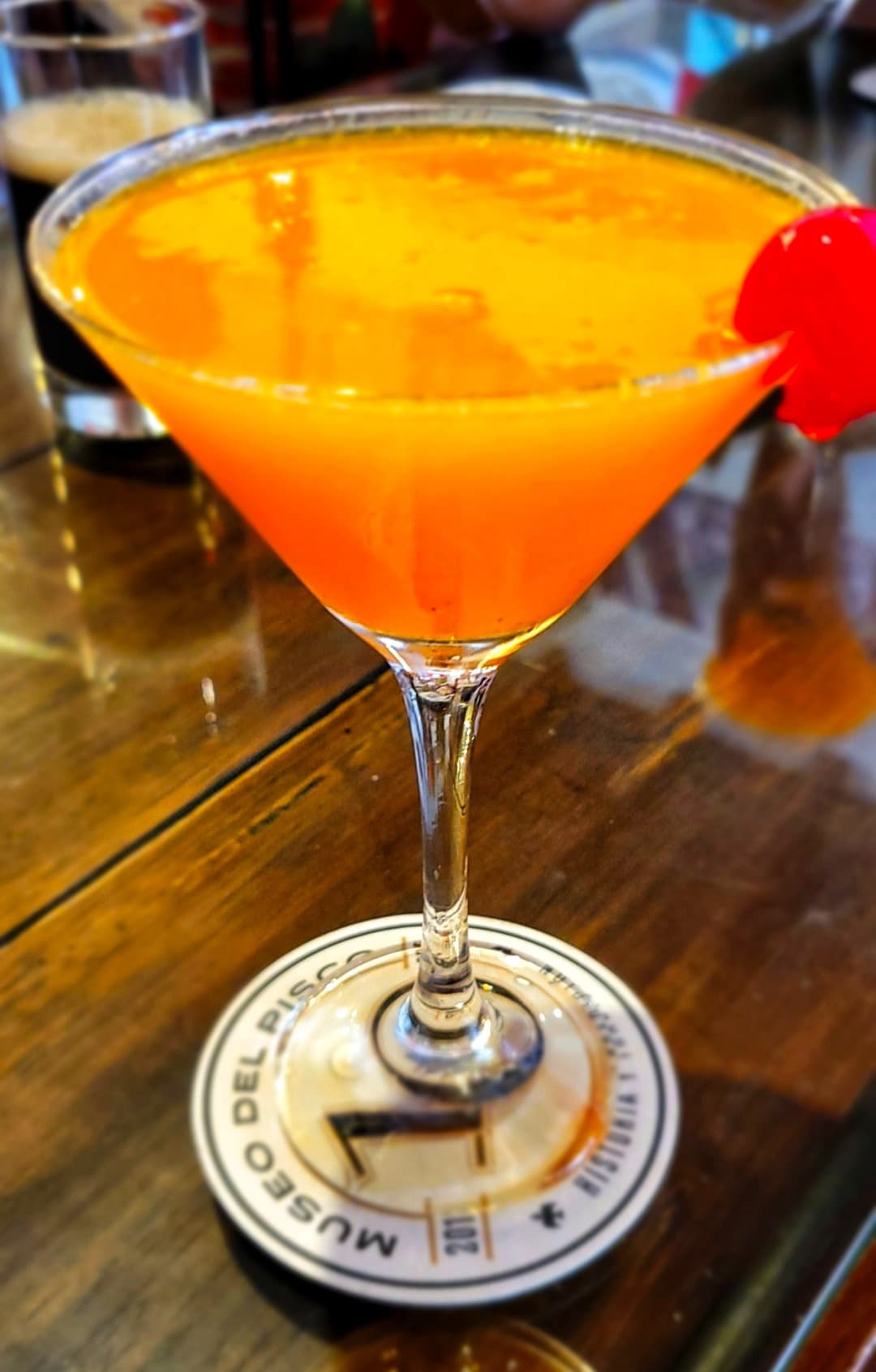 Tropical drink in a martini glass.