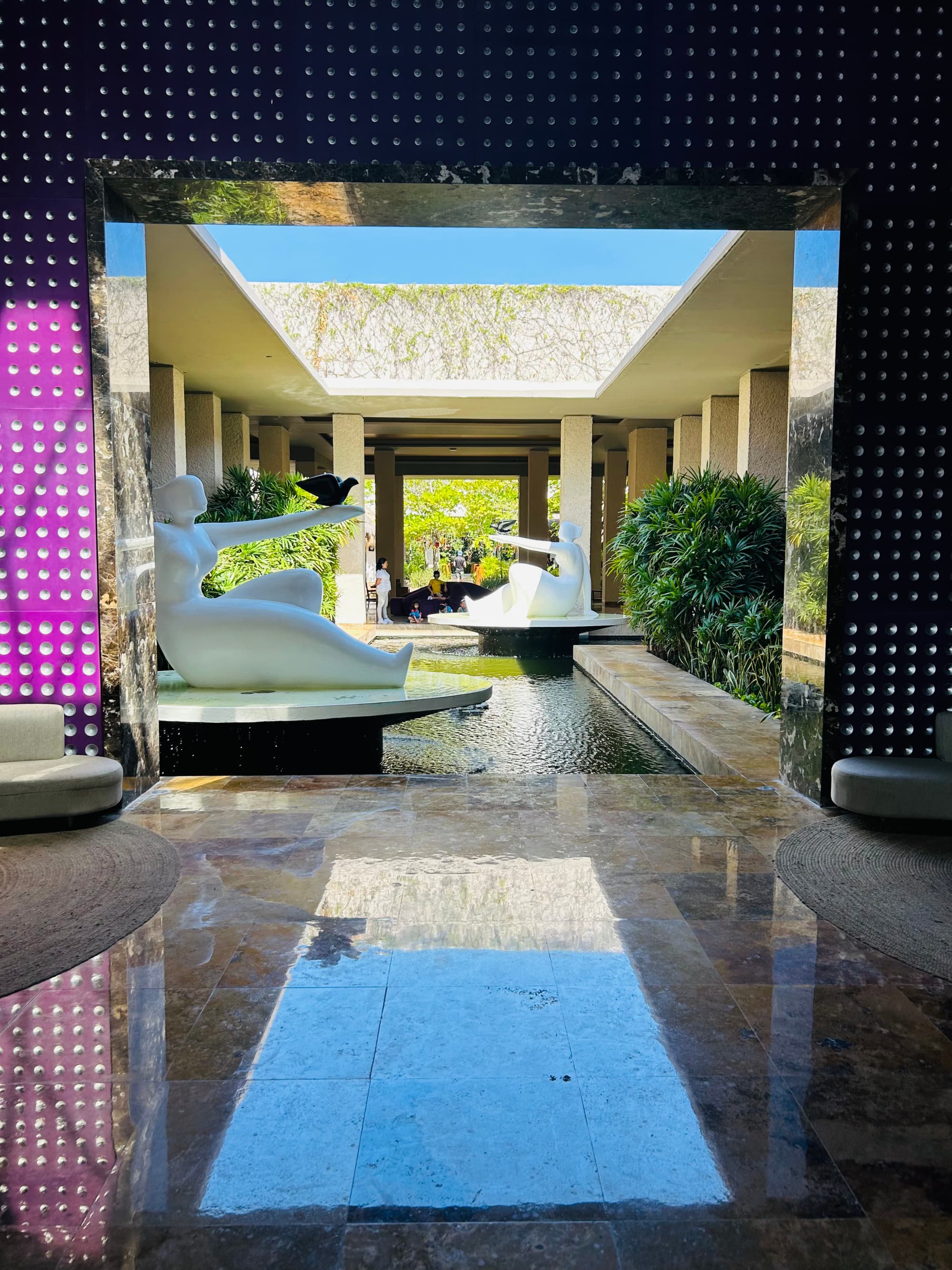 A hotel lobby with lots of art sculptures