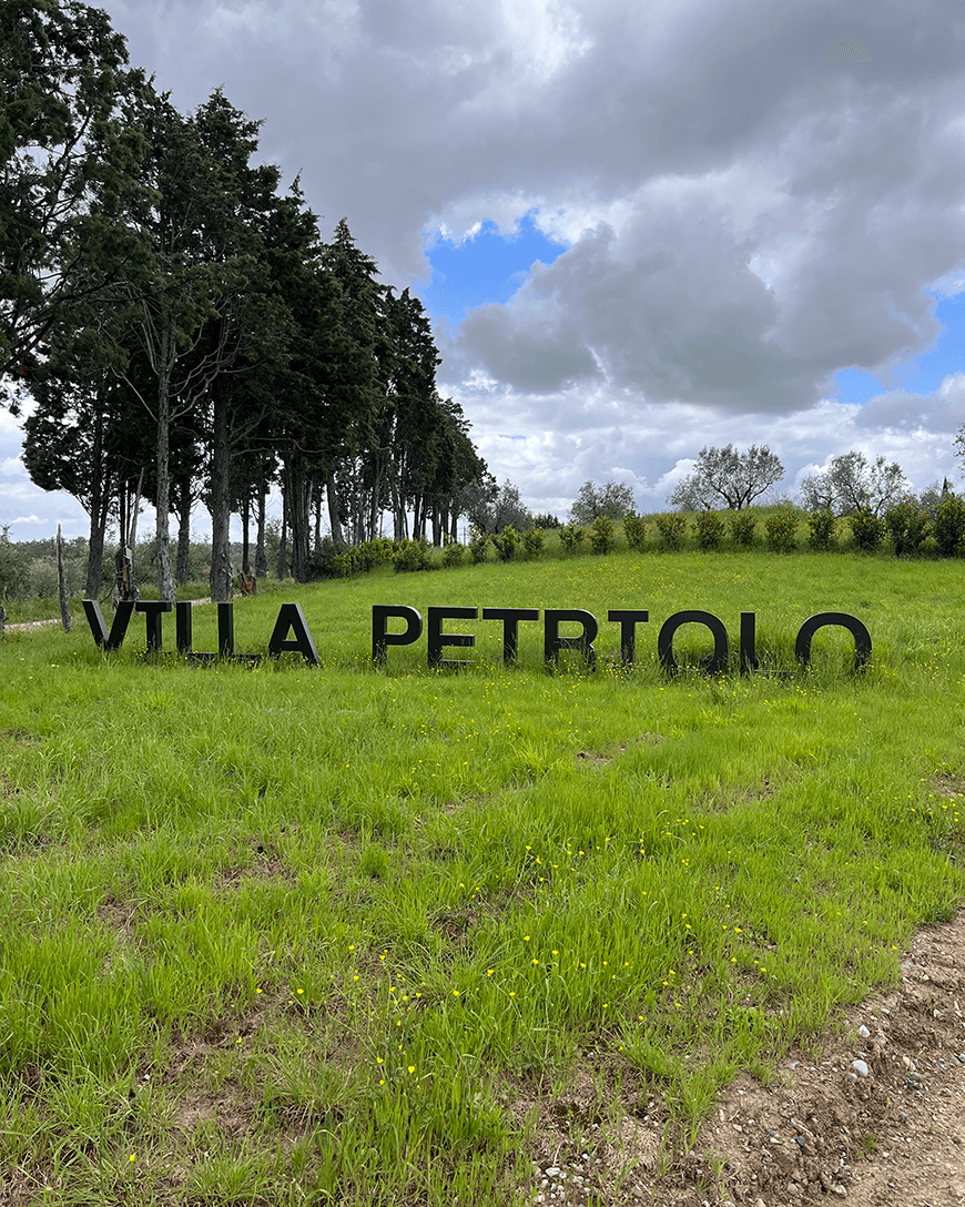 Villa Petriolo lettering planted into the grass of the establishment's grounds.