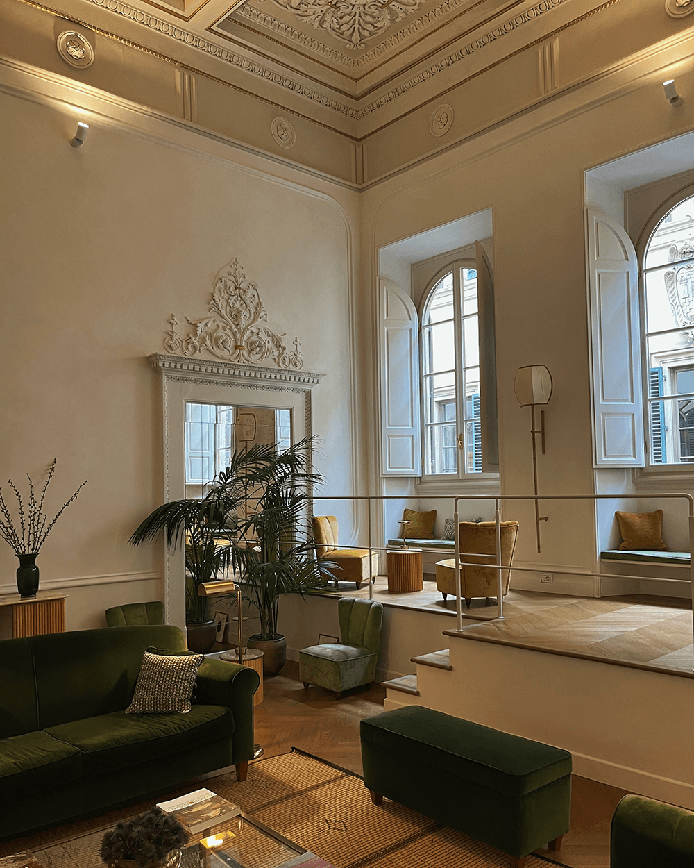 Hotel lobby with tall, white walls