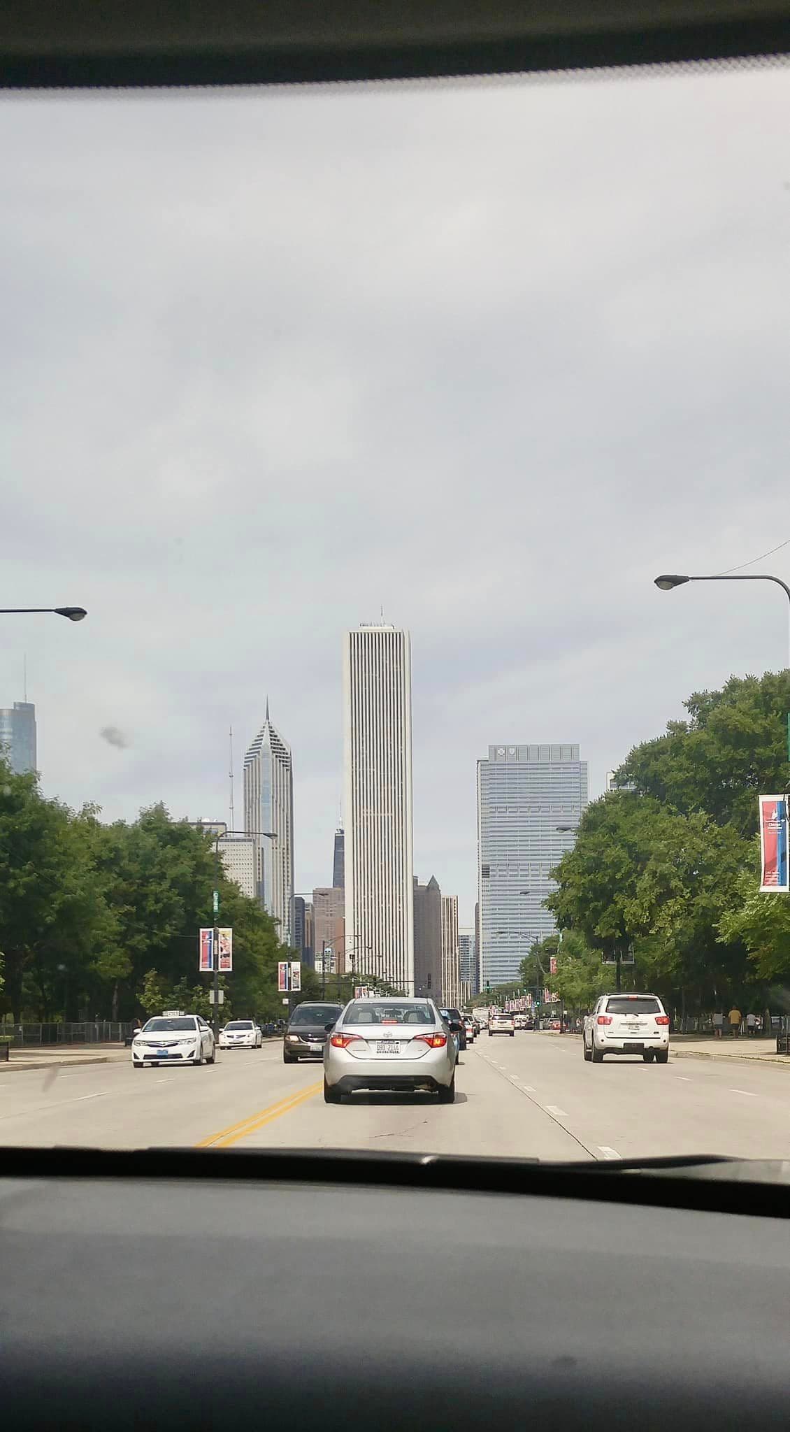 View of a road with a city skyline in the distance