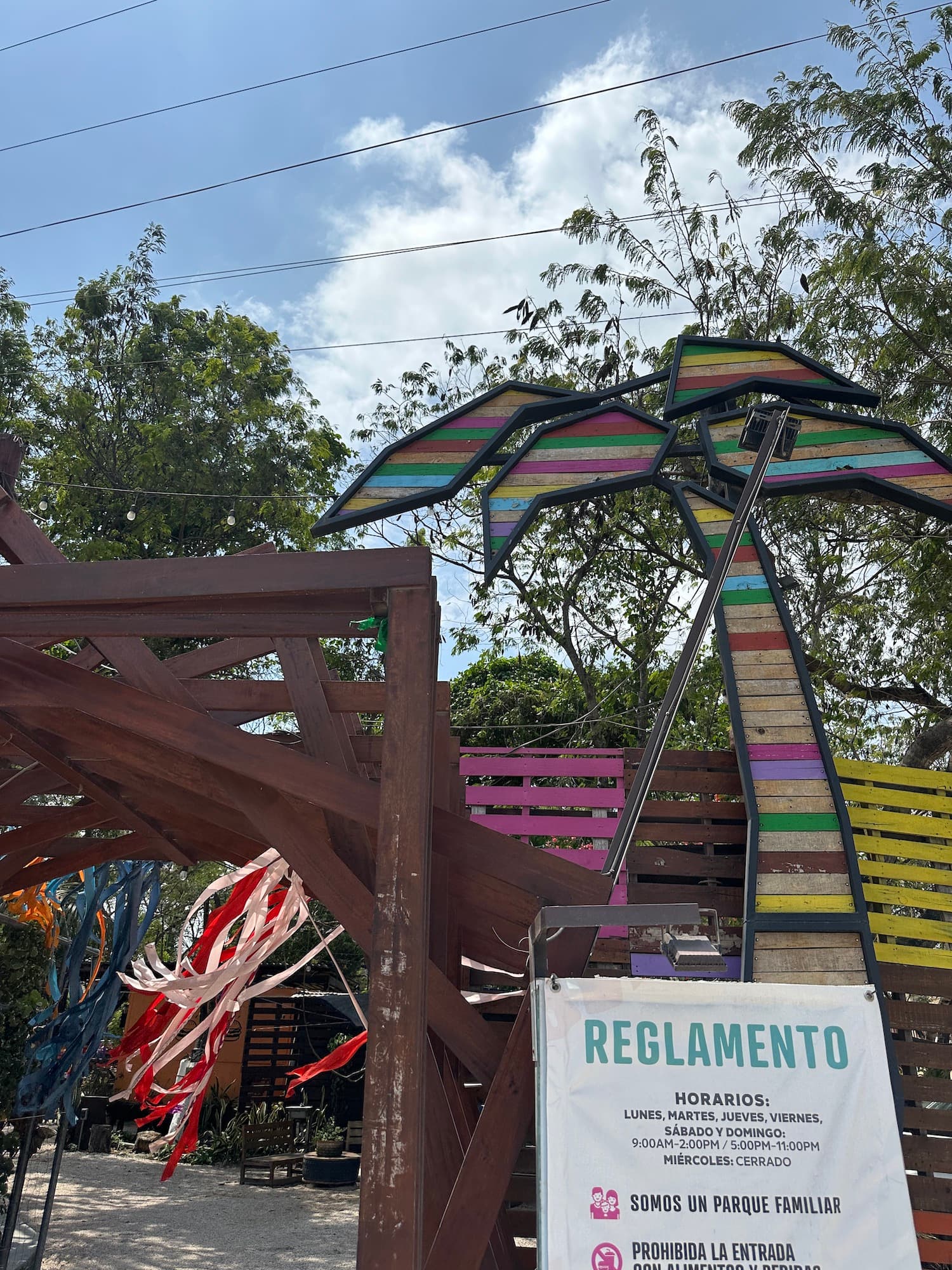 An outdoor area with colorful wooden signs
