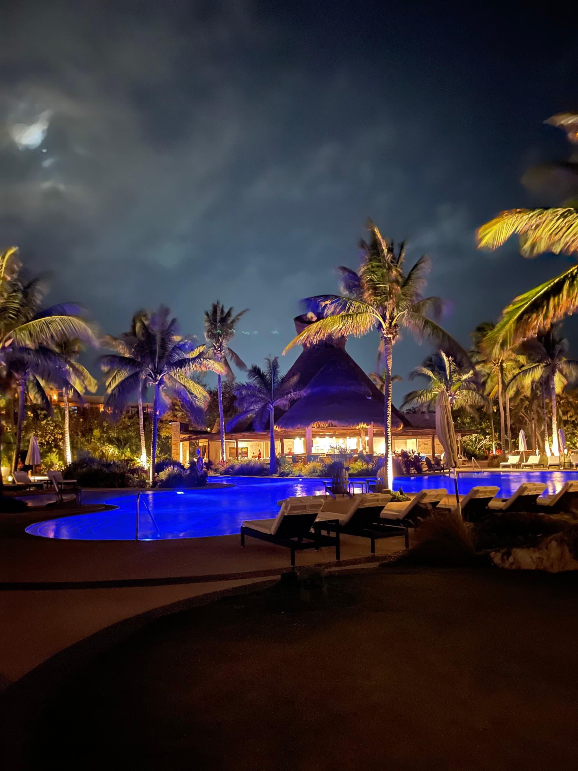 A pool area lit up at nighttime