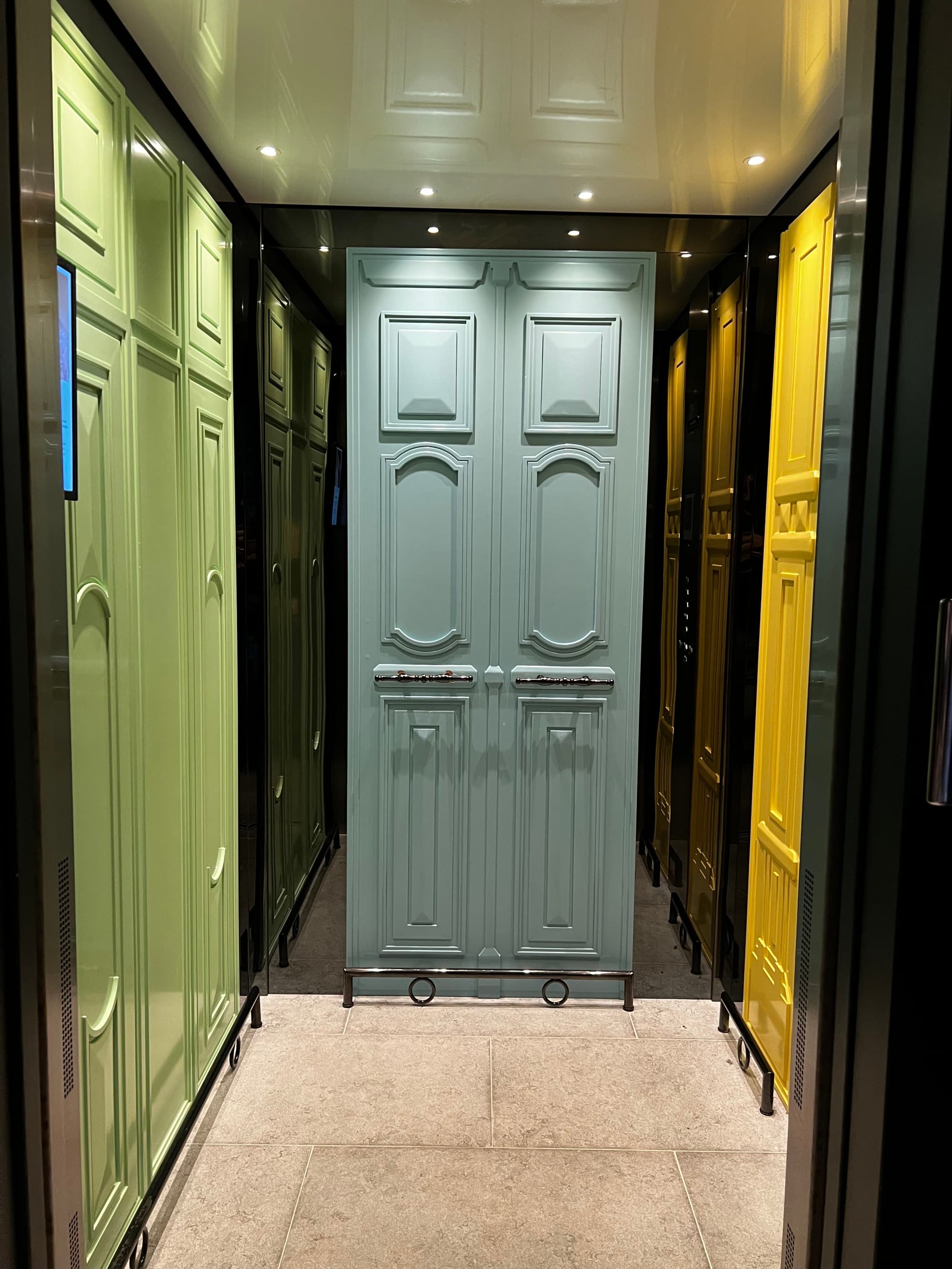 Hallway view, with colorfully painted doors