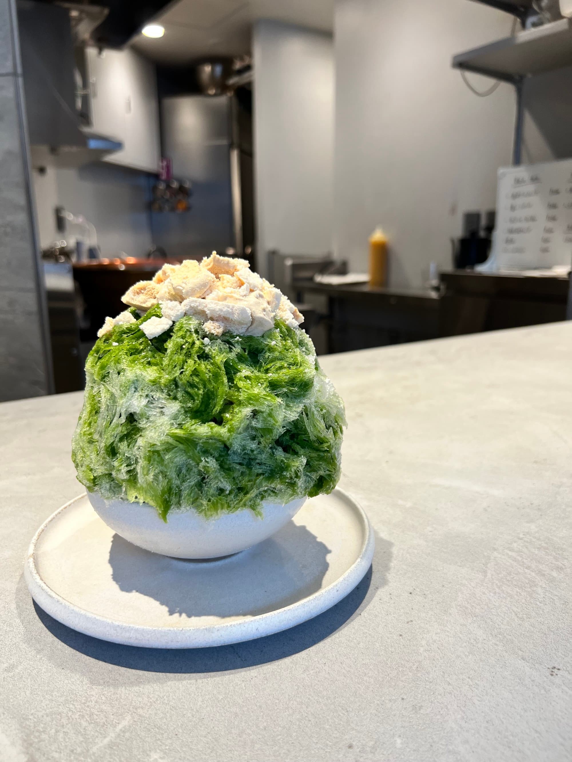 A bowl of green ice cream