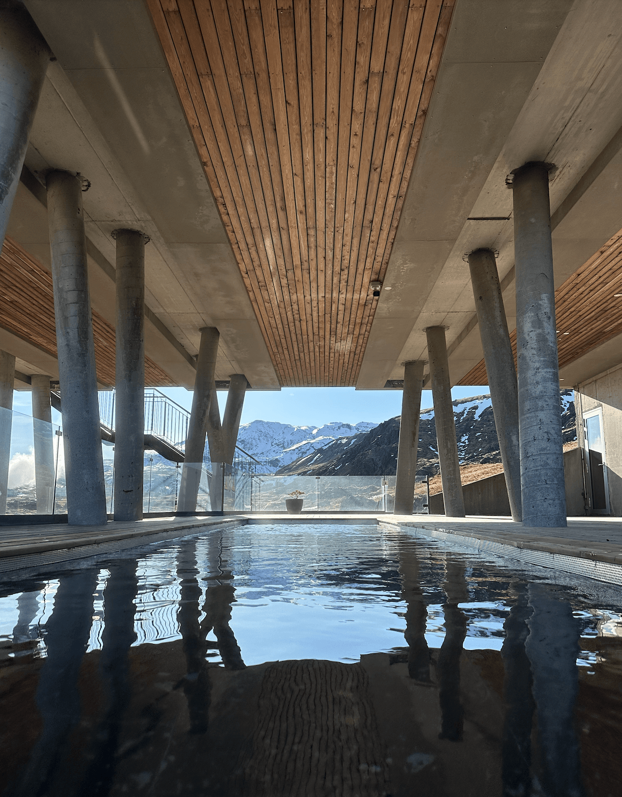 Ion Geothermal Pool with a wooden deck overhang - Kati Vervack