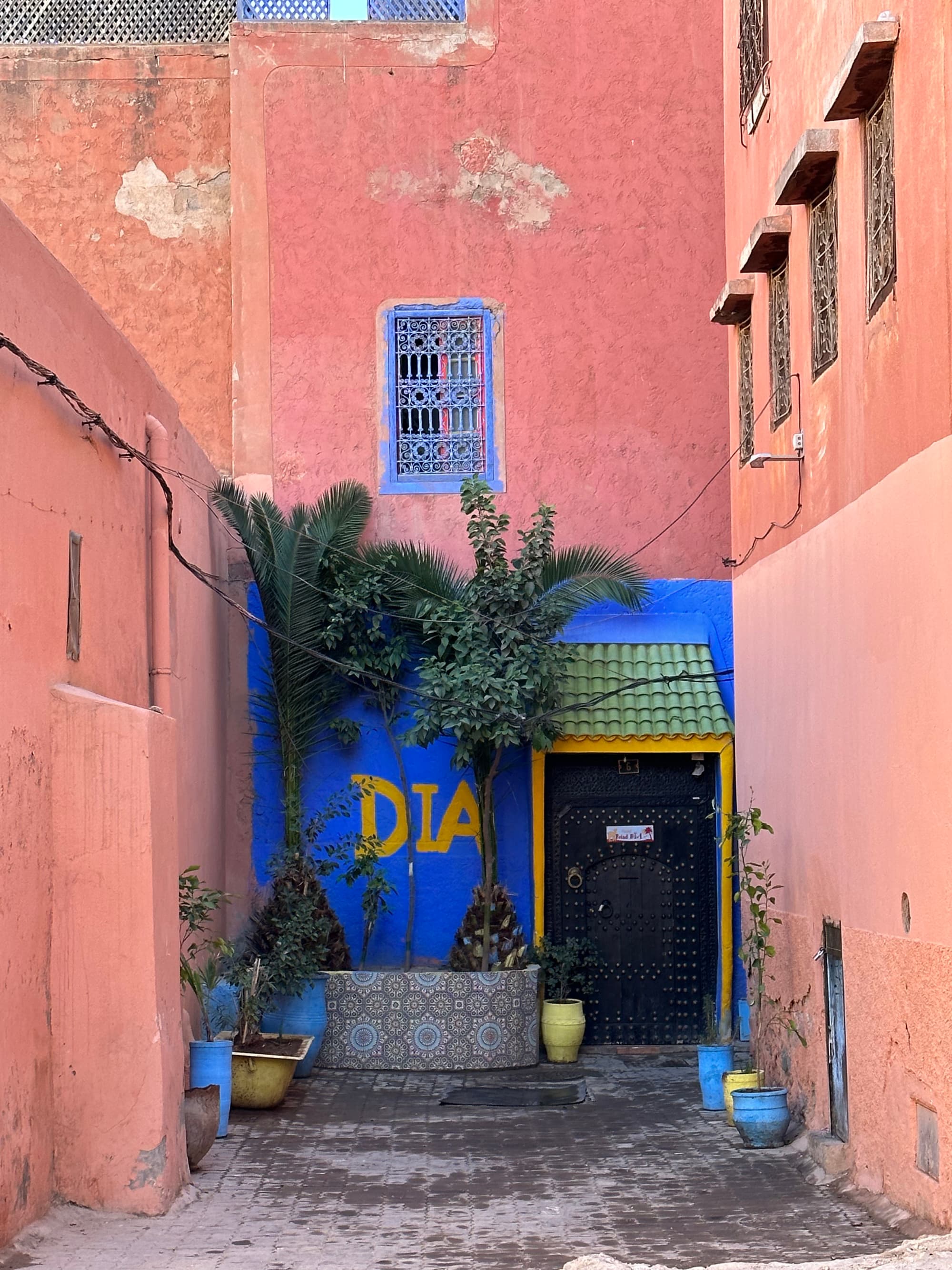 Alleyway of pink and orange buildings