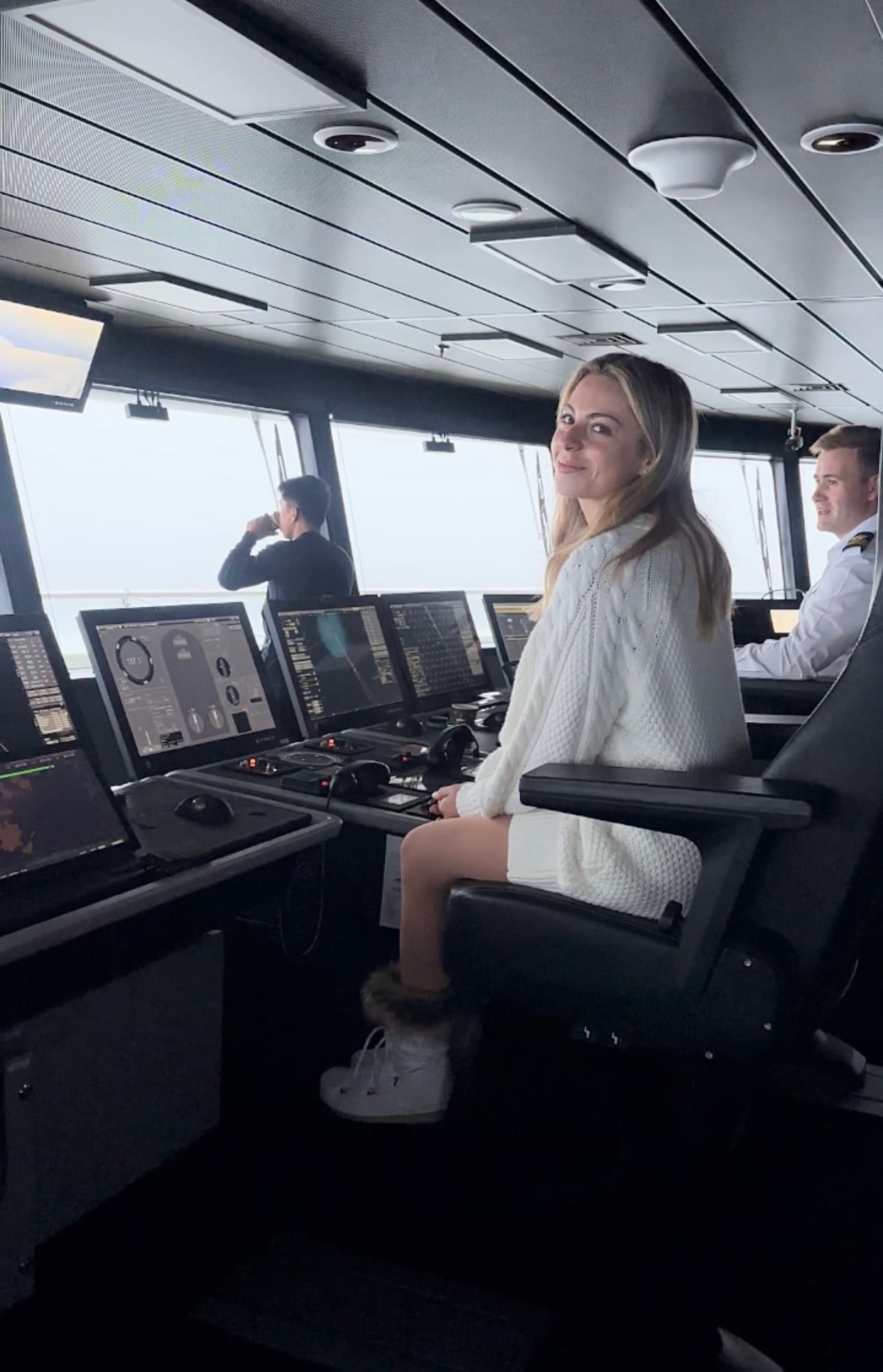 People sitting in the navigation room on a ship