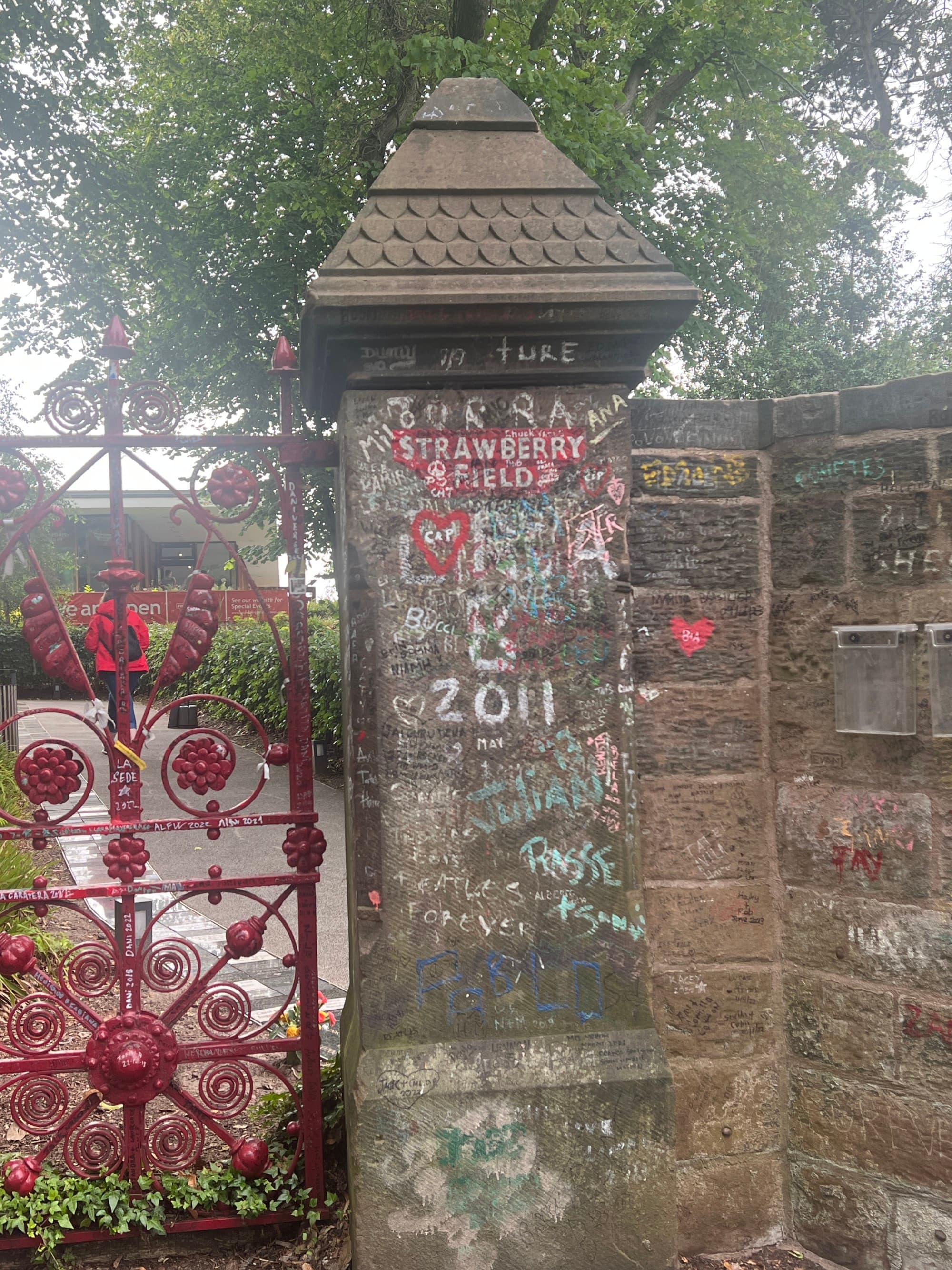 A brick post with graffiti