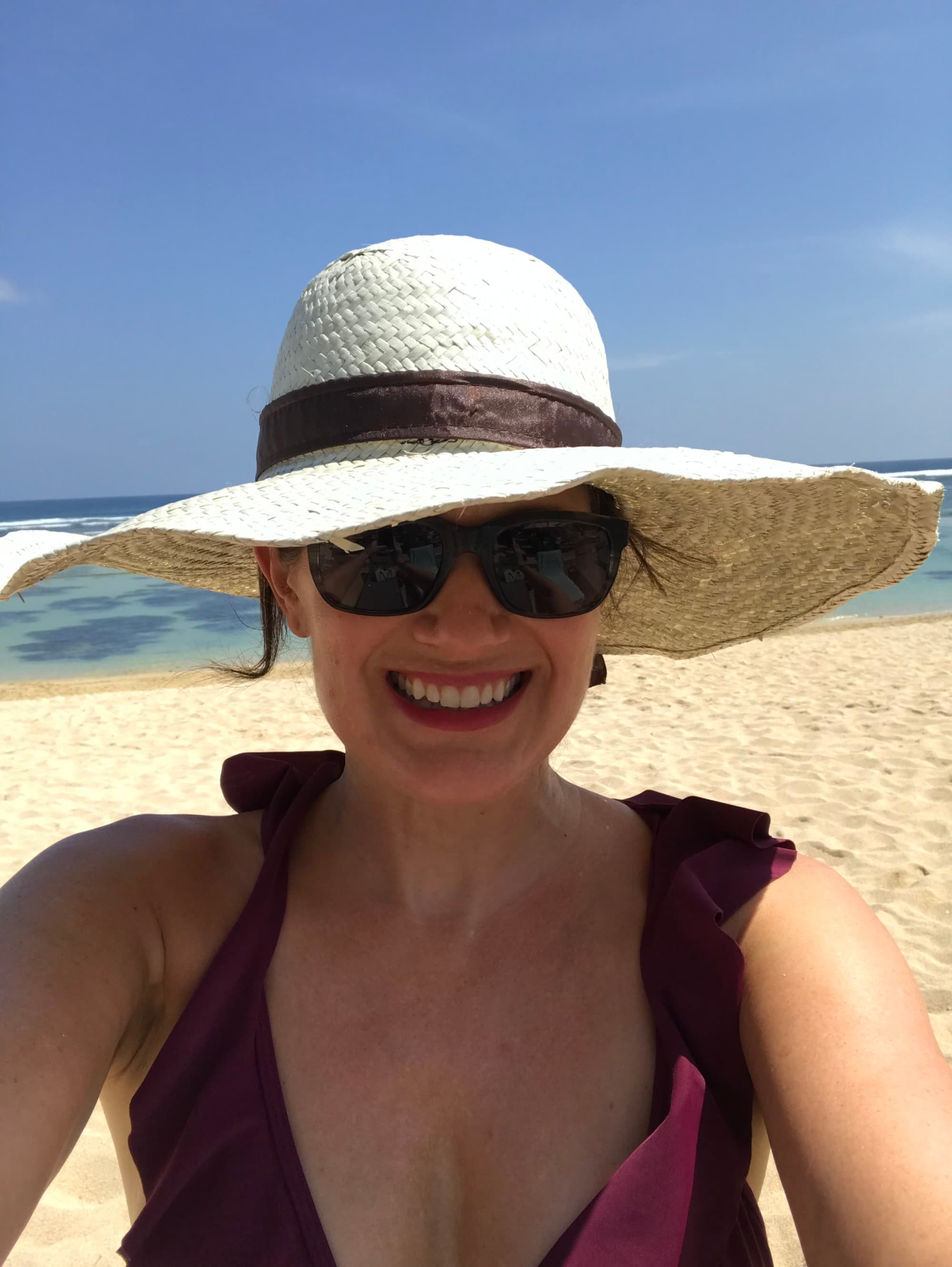 Travel advisor posing on beach