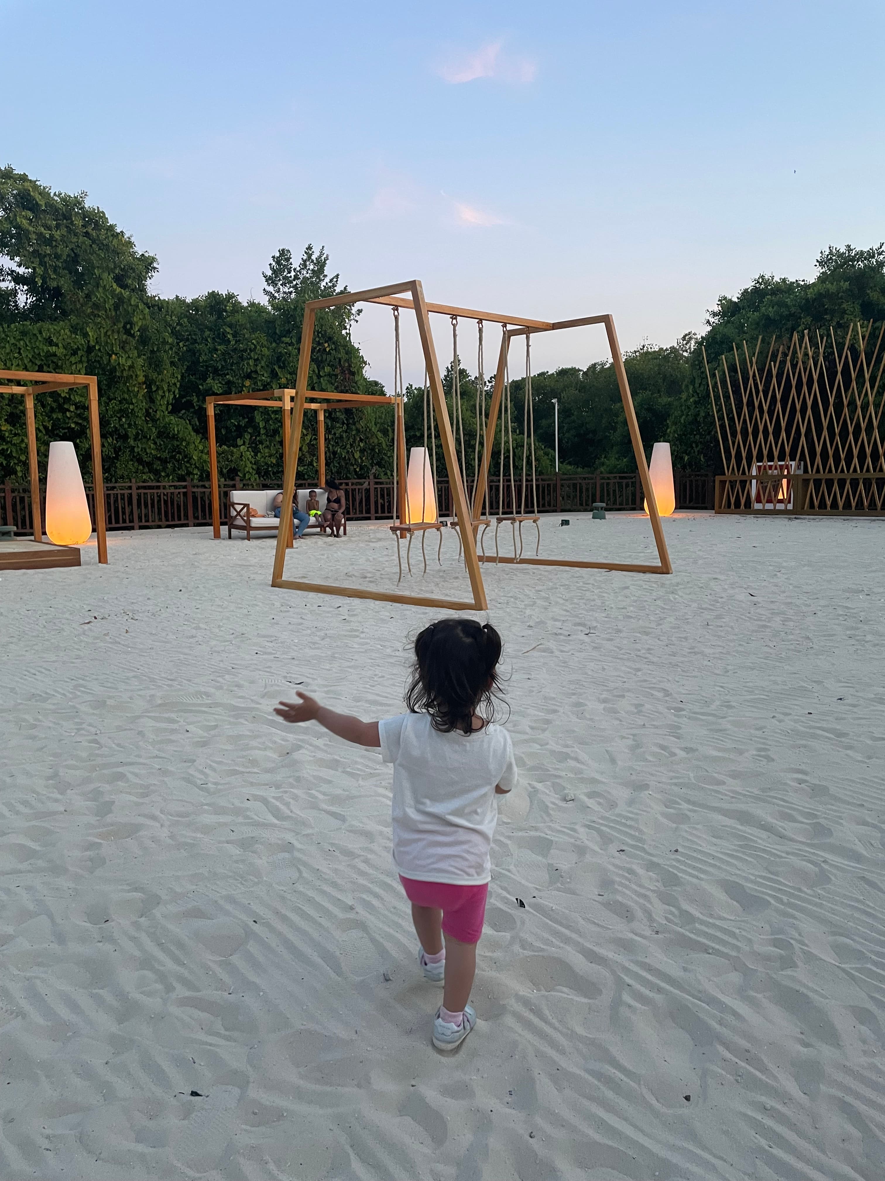 kid playing on the sand