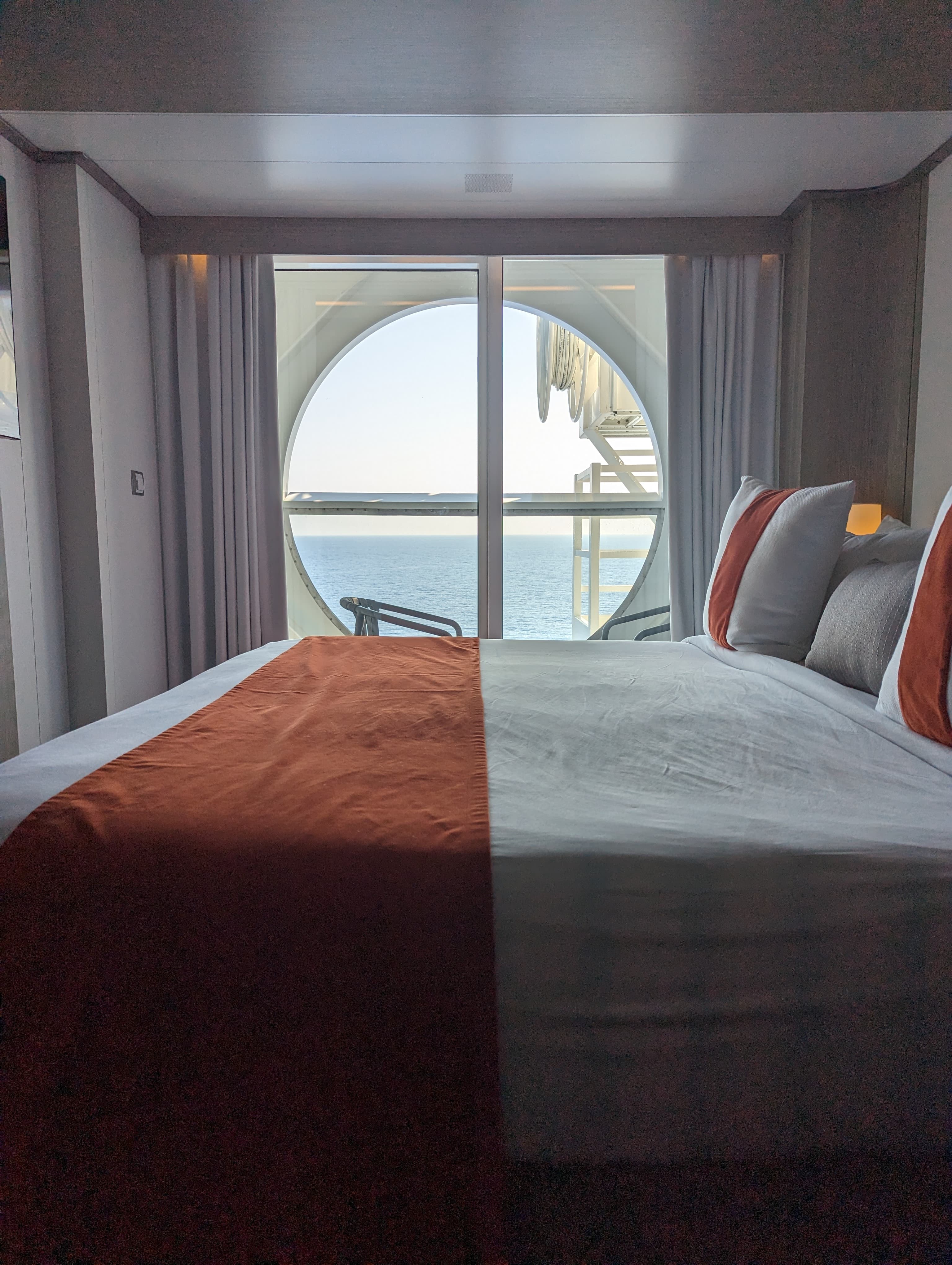 Hotel room and glass window with sea view