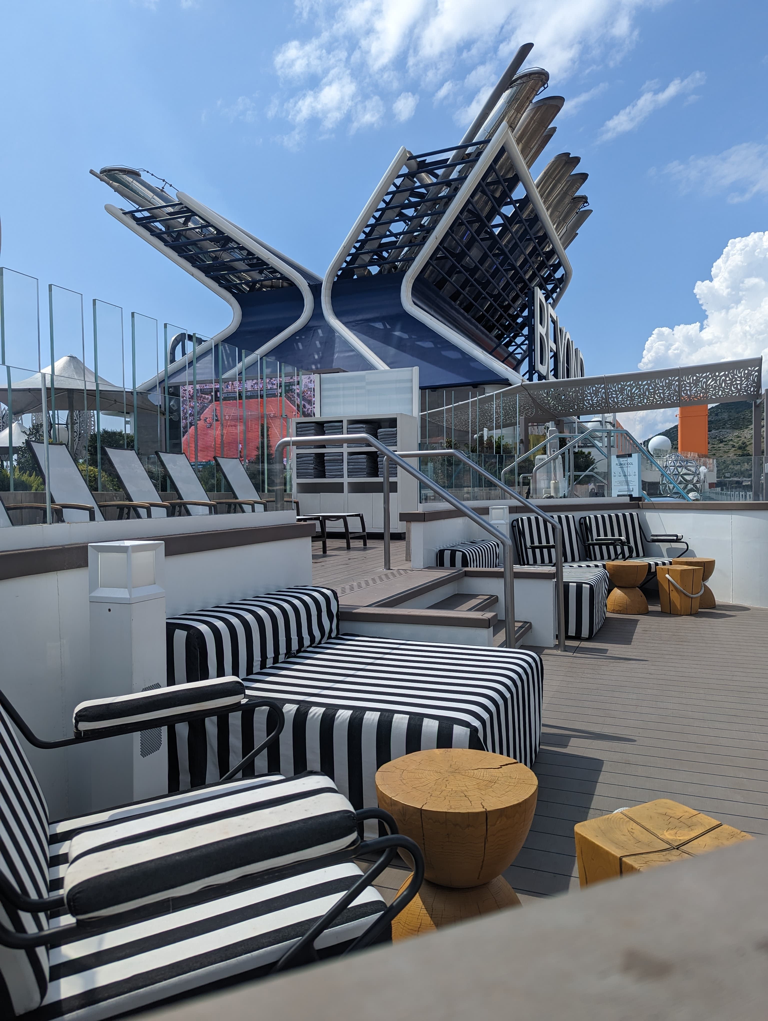 Deck of the ship with resting chairs and tables