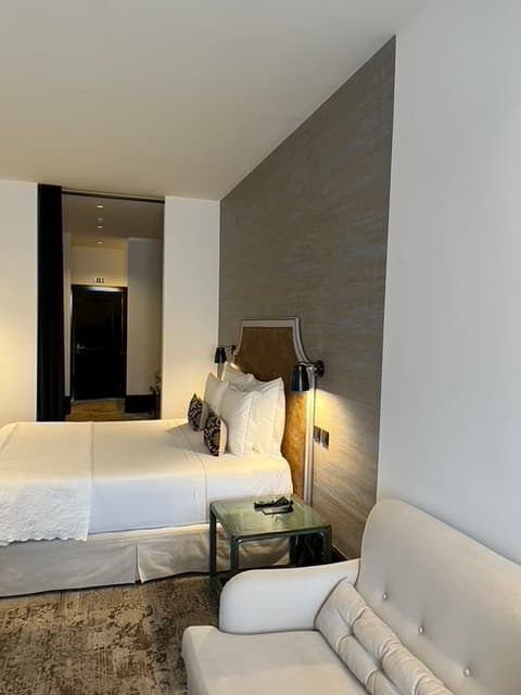 a white bed in a hotel room