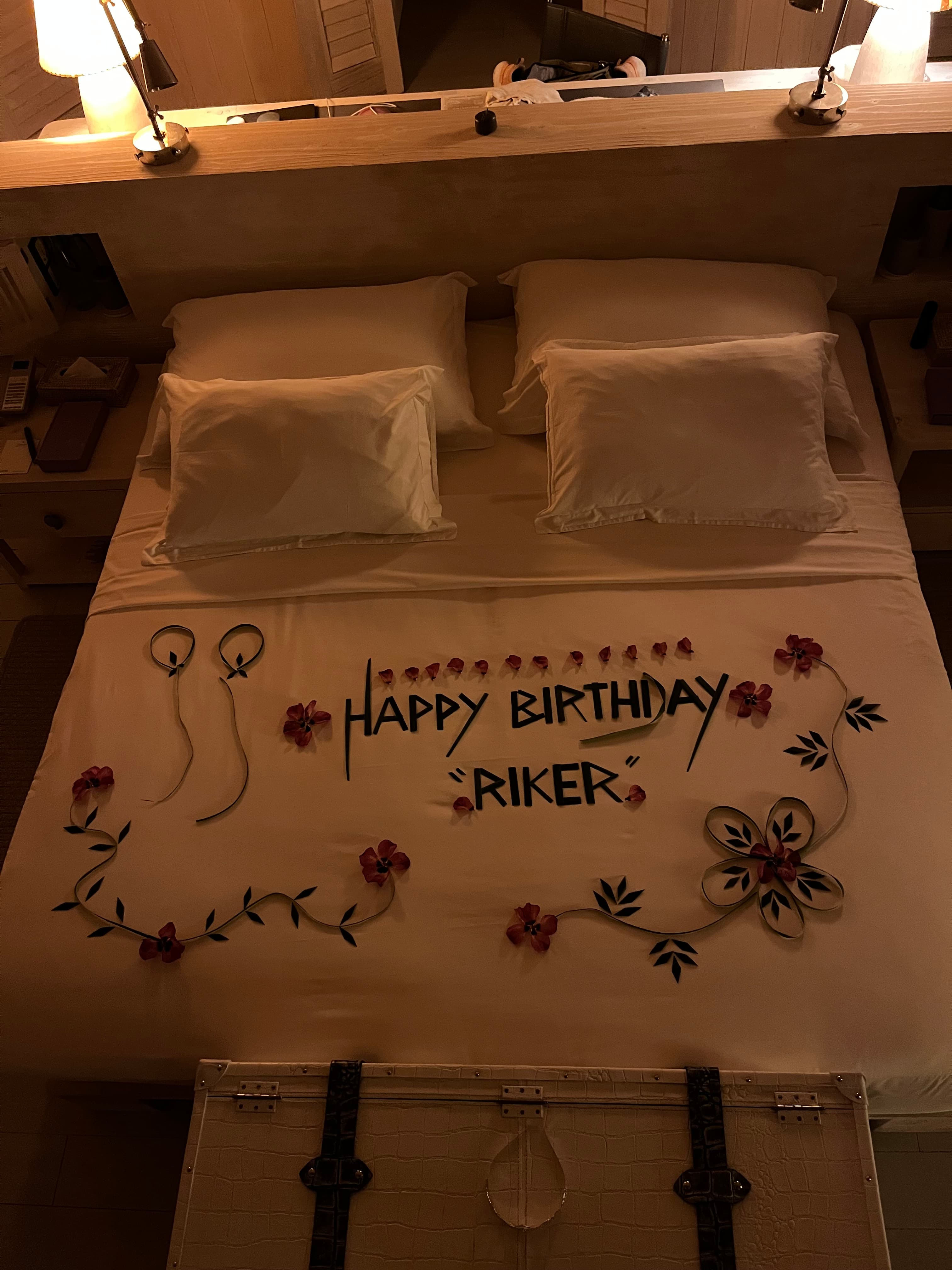 View of bed with happy birthday written