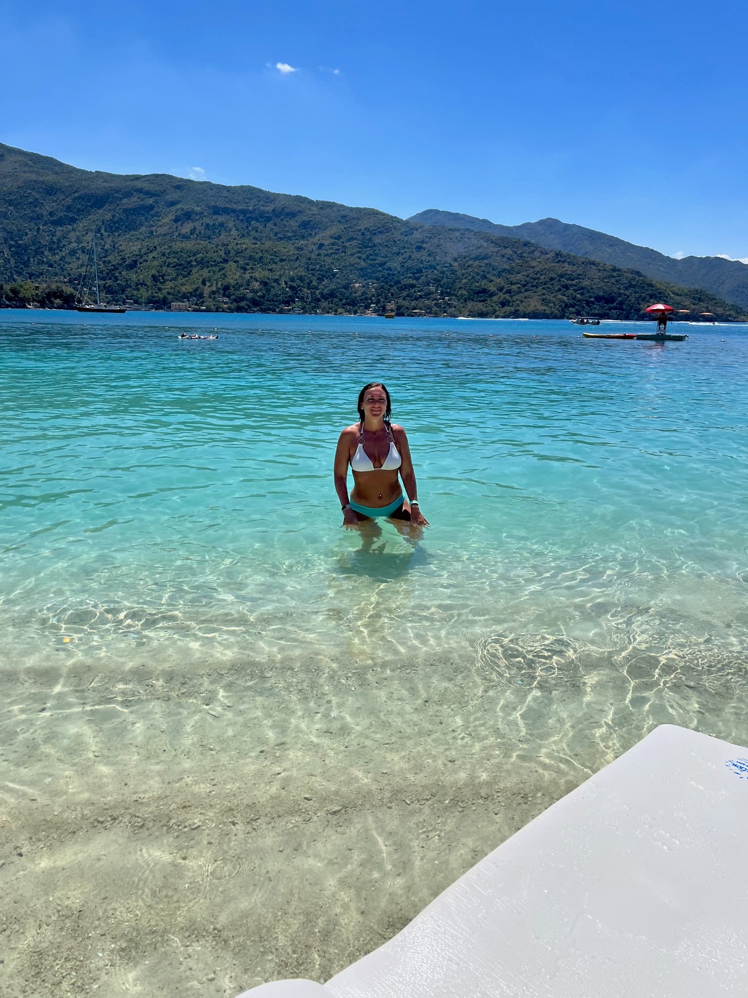 Photo of the advisor in the water off of a beach