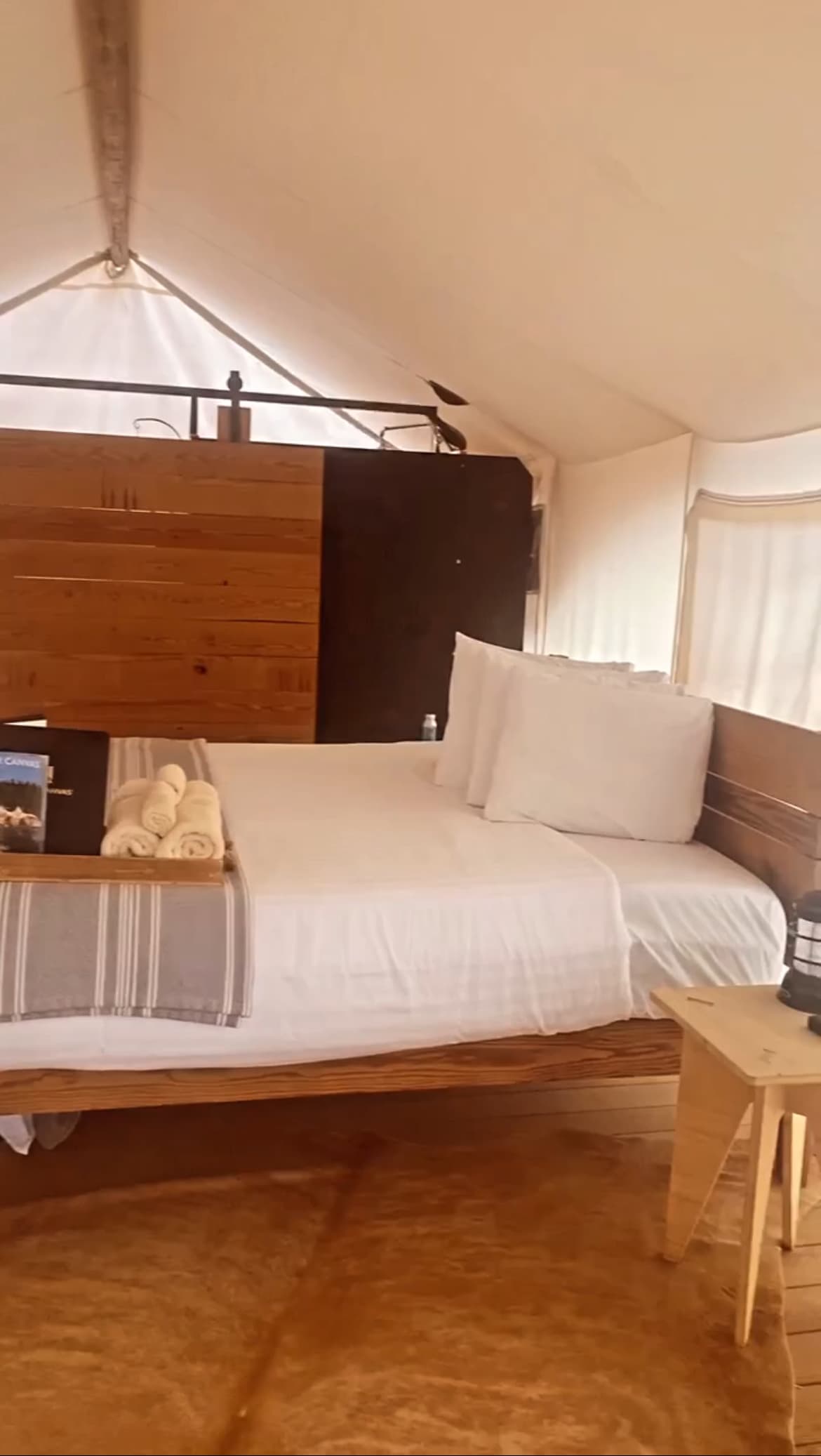 A bedroom under a white canvas