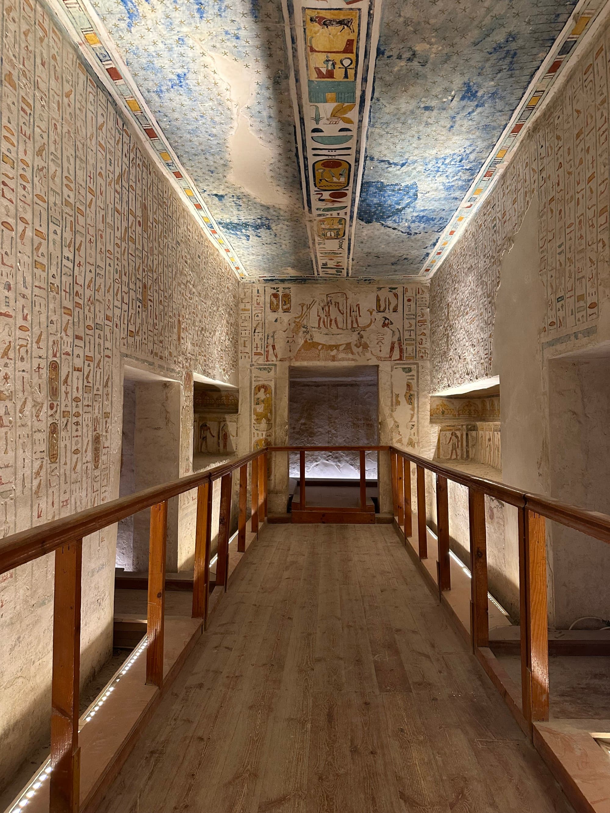 Valley of the Kings - the inside of a building with colorful carvings on the ceilings and walls