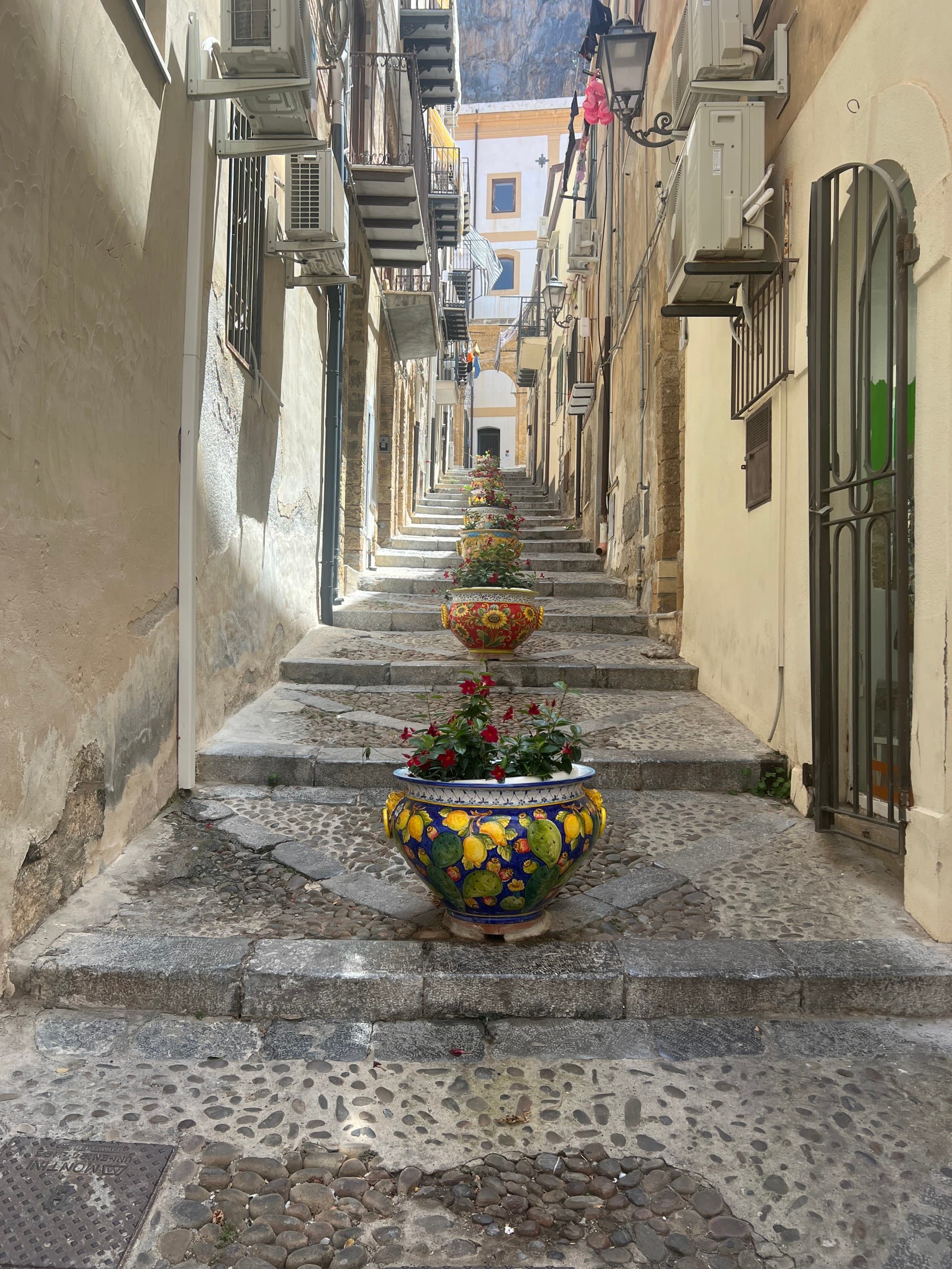 Image of stone stairs in a narrow street in Cefalu