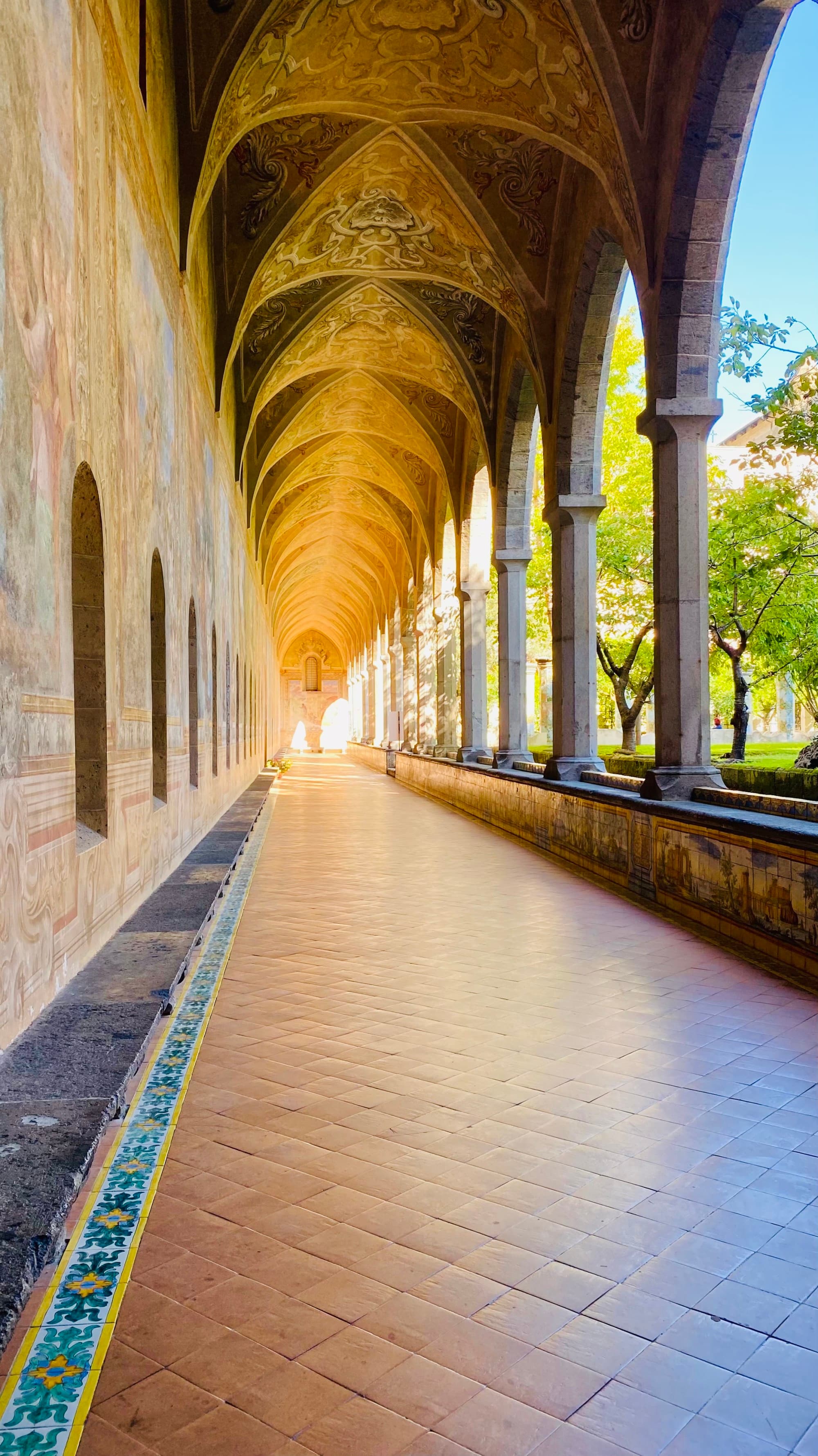 An exterior hallway with arched ceilings