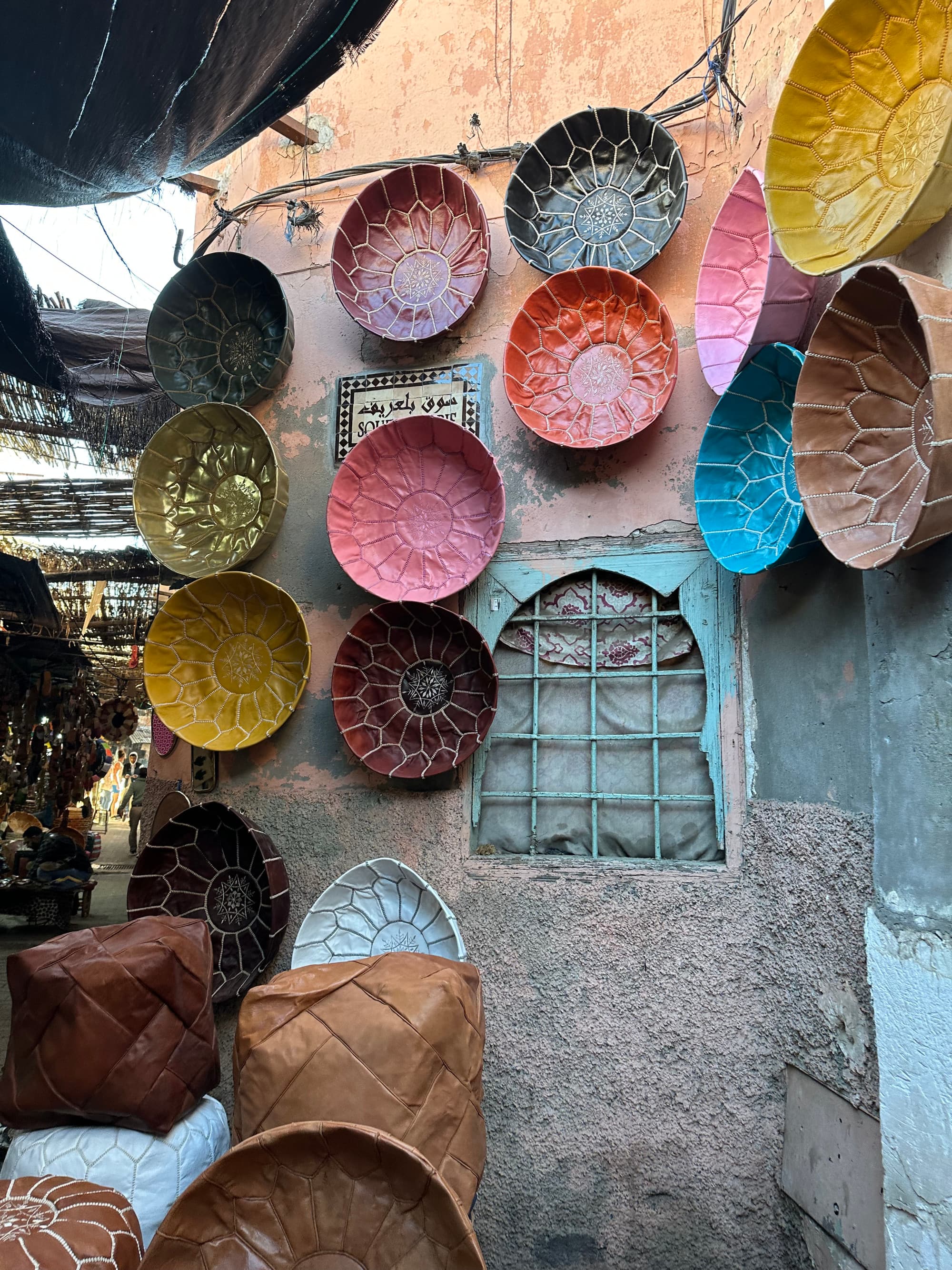 Colorful plates on a stone wall