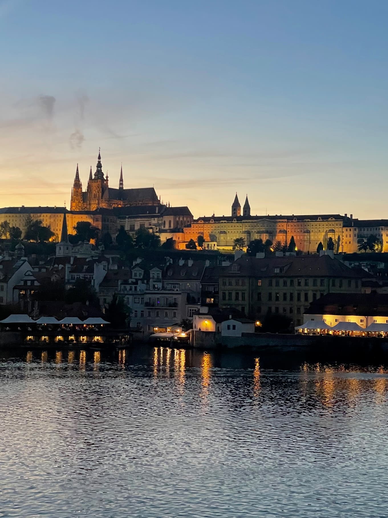 Charles Bridge at sunset with a beautiful bridge and water way - Lauren Baroevich