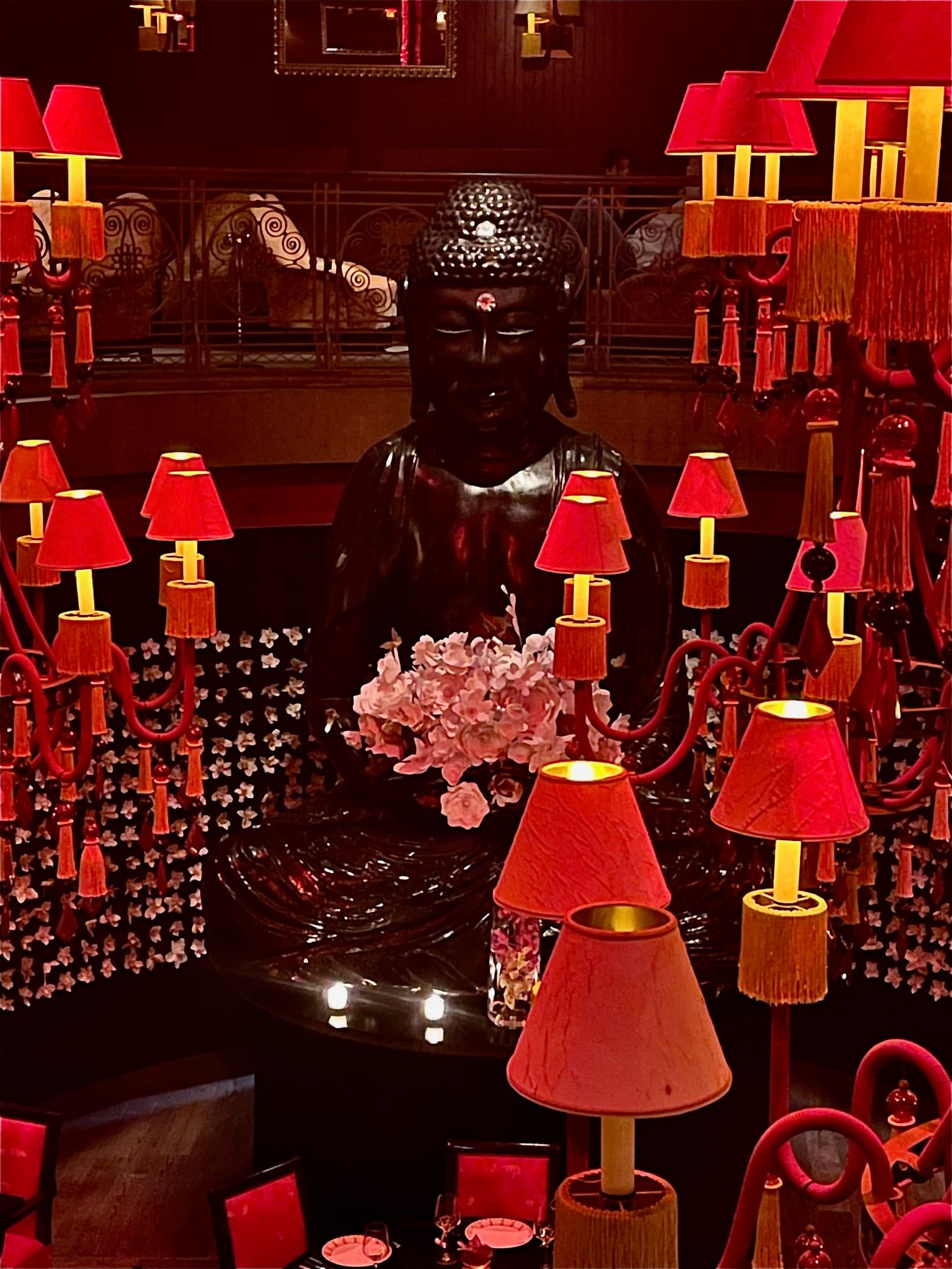 Buddha Bar lit up in with dark red lamps - Lauren Baroevich