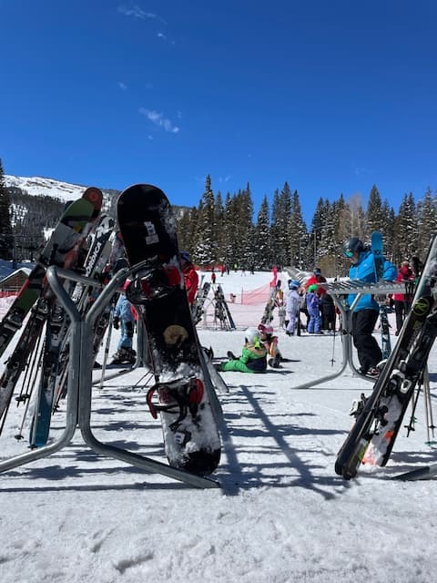 Snowboards at the bottom of a mountain you can visit while in Aspen Colorado for New Years.