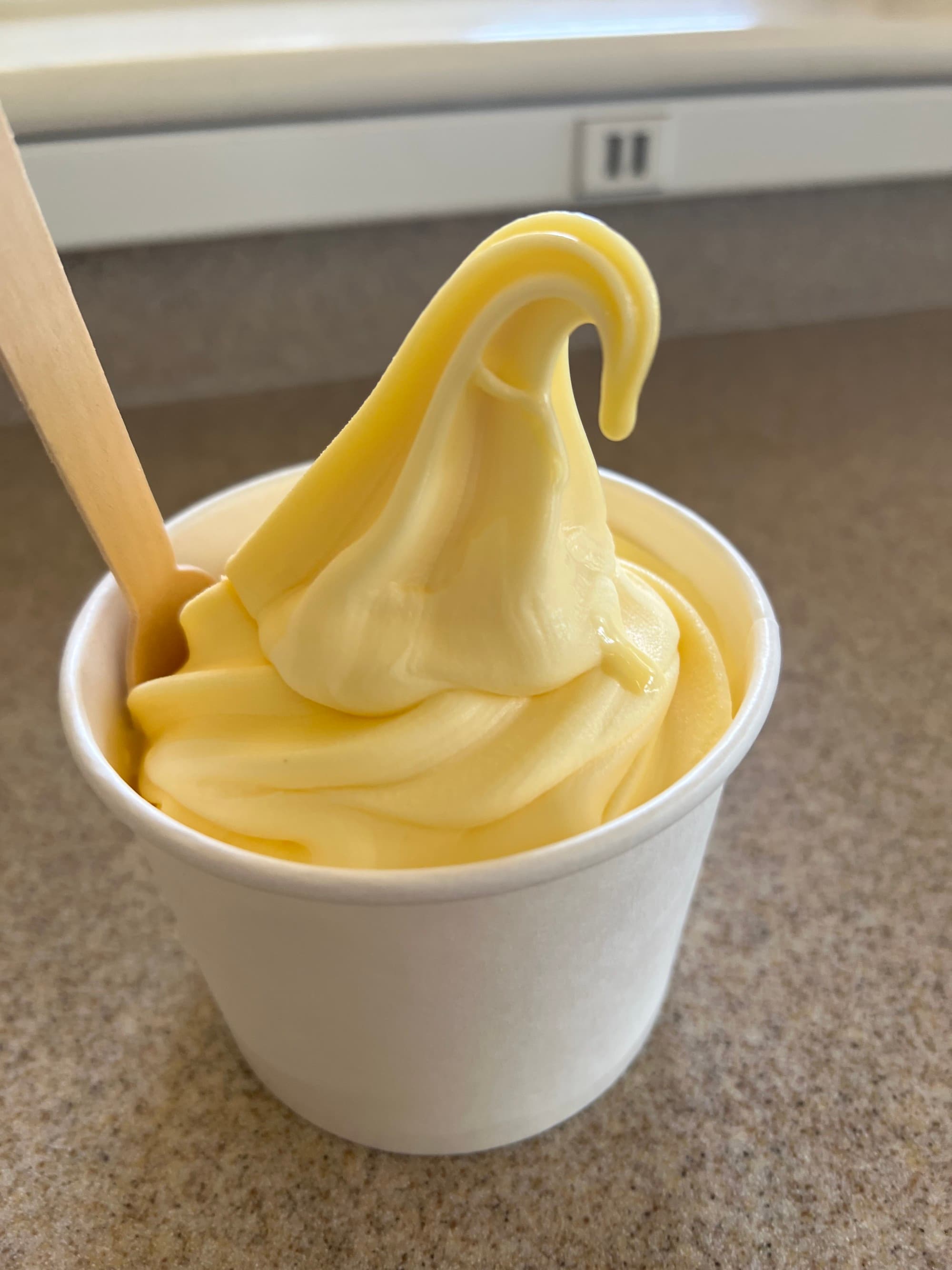 A tantalizing cup of mango-colored Dole Whip from the Dole Plantation.
