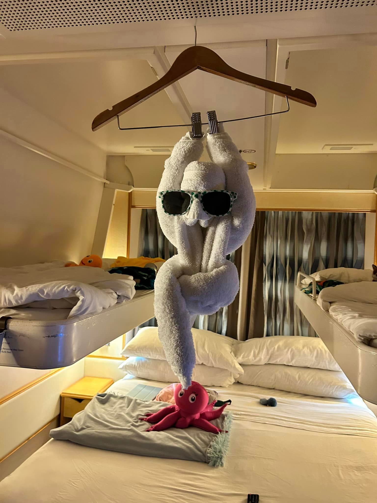 A towel folded in whimsical way in a cruise ship room
