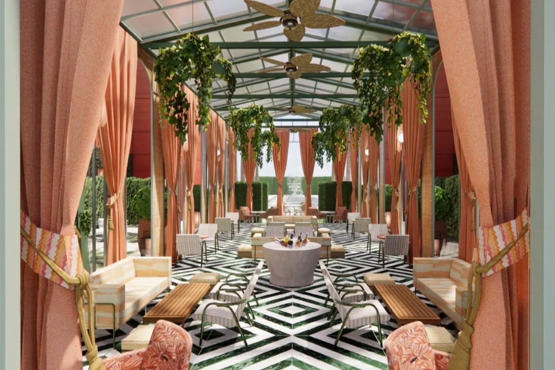 pink curtains and greenery adorn a rooftop hotel area