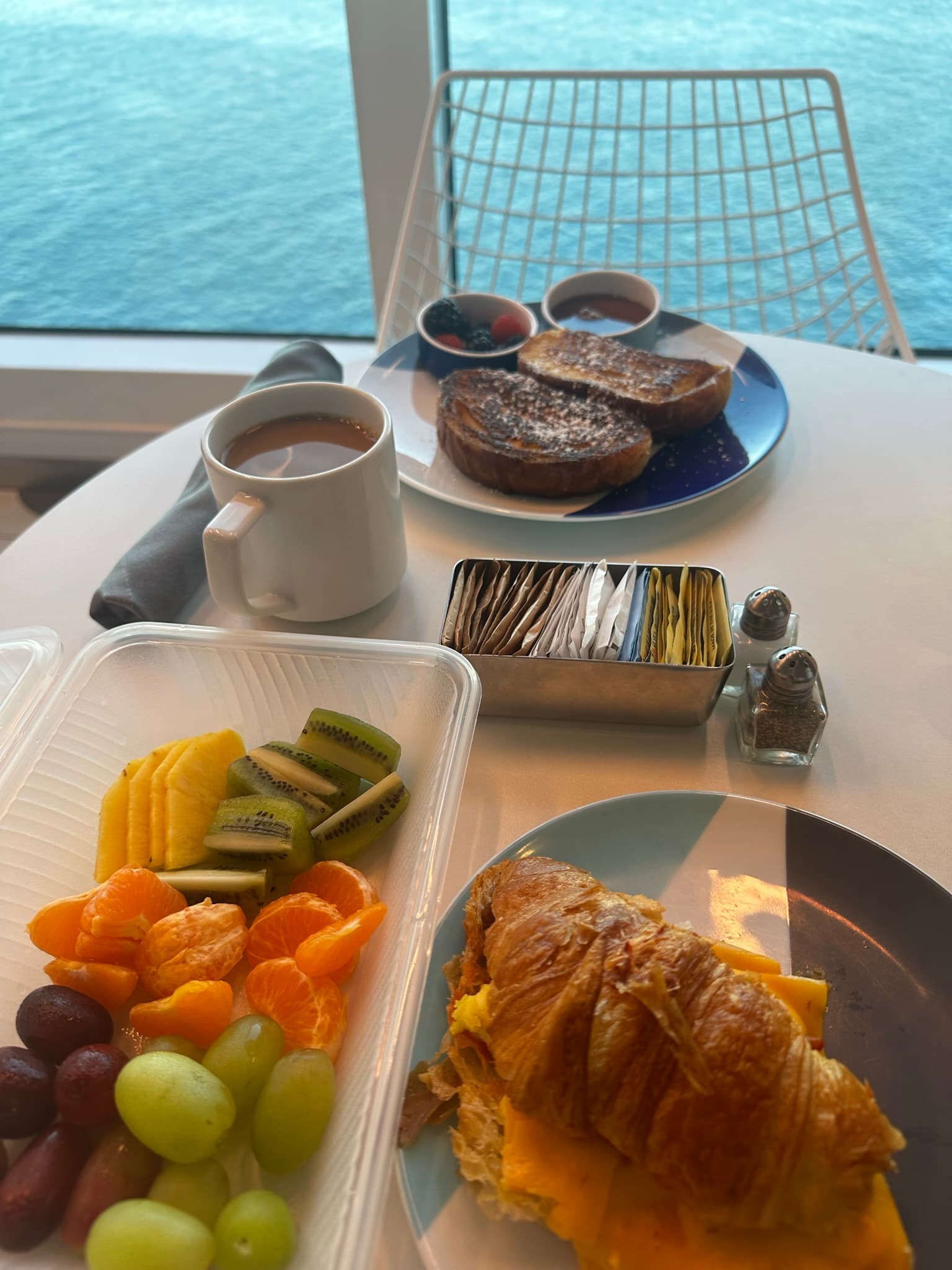 A table with breakfast at The Galley overlooking the ocean - Shelly Maffia